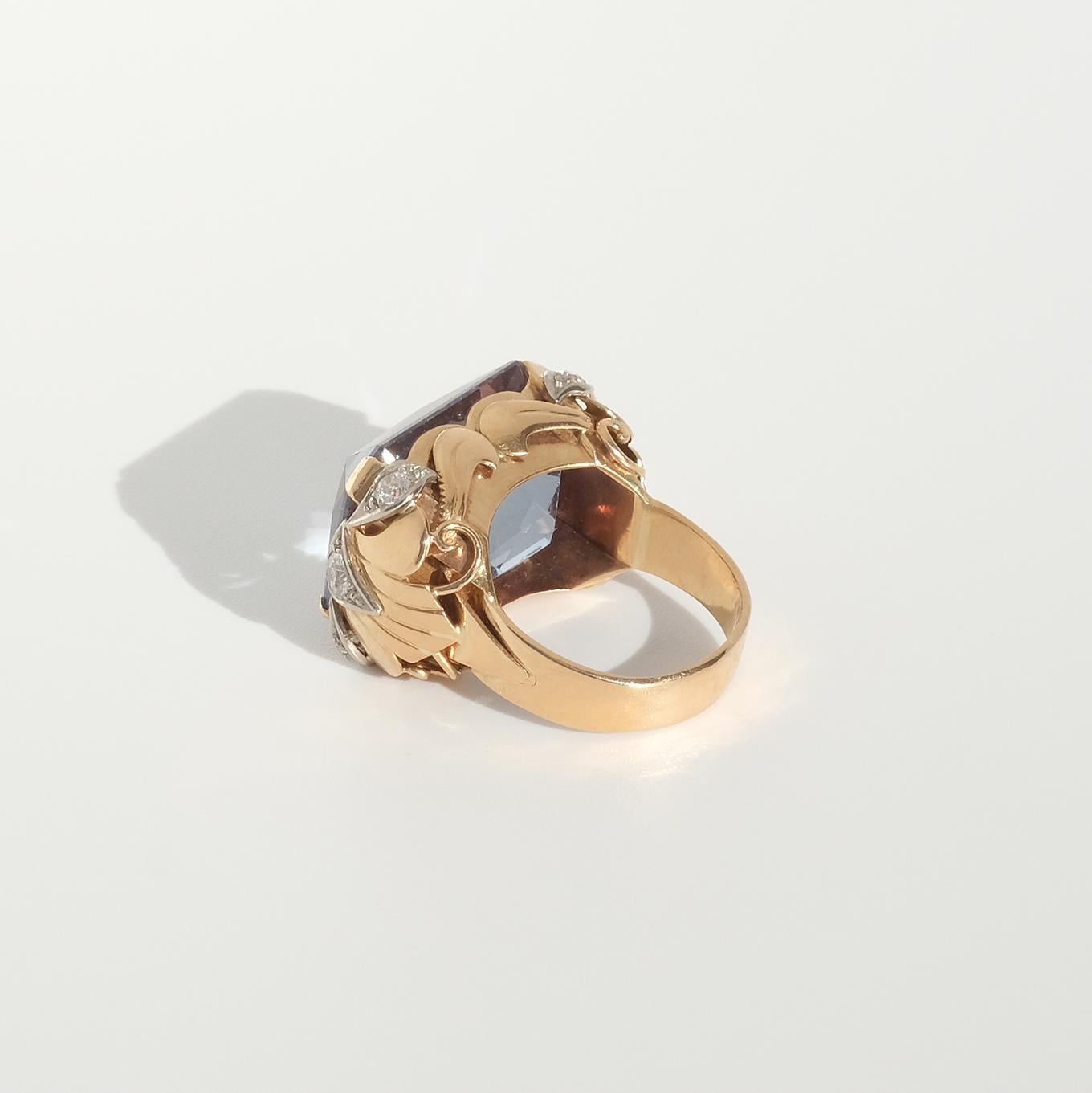 Old European Cut 18 karat gold ring with a large synthetic spinel and diamonds.