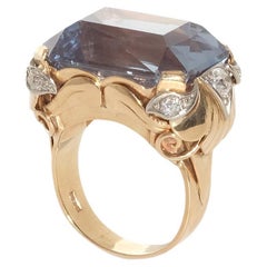 18 karat gold ring with a large synthetic spinel and diamonds.