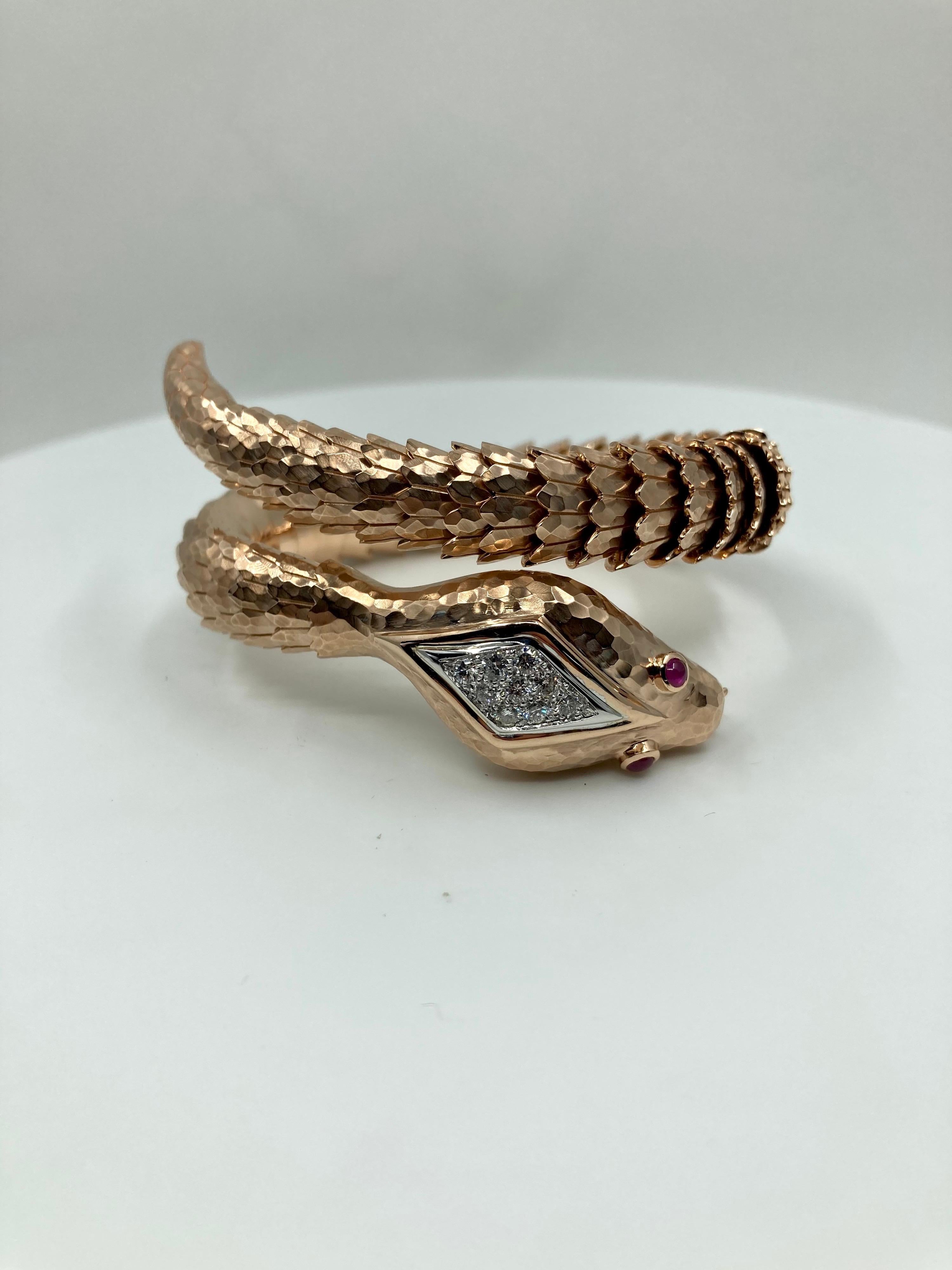 Timeless Rose Gold Bracelet, with Diamonds ct. 0.55 and Rubies ct. 0.20, handmade in Italy by Roberto Casarin.

A timeless fine handmade creation with an exotic subject. This snake bracelet is an authentic example of true Italian craftamnship and
