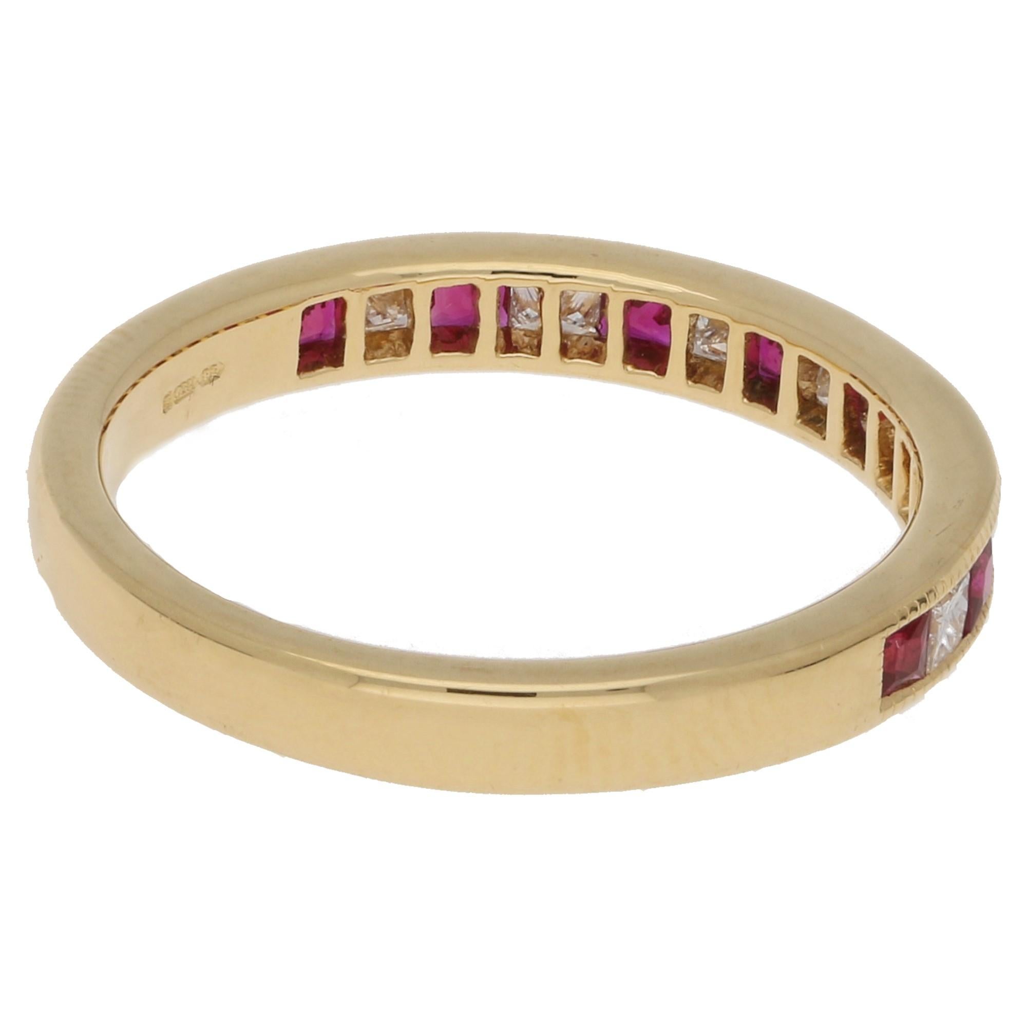 An 18ct yellow gold ruby and diamond set half eternity ring. The ring is set with 0.58ct's of intense ruby and 0.31ct's diamond. The edges have a delicate millegrain detailing. This ring is an M 1/2, but can potentially be sized upon request.