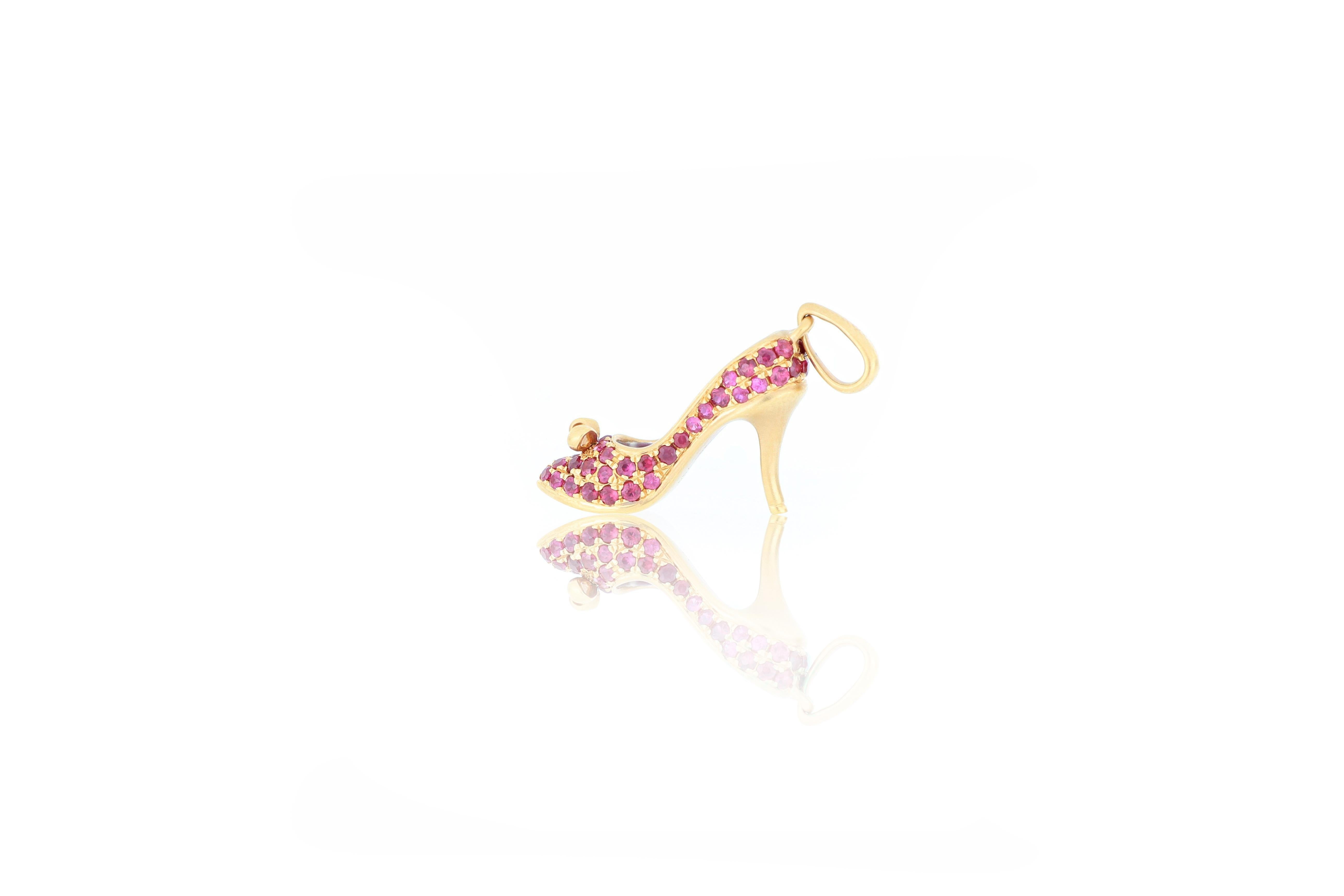 An elegant and very special high heel shoes pendant, set with ruby weighing 0.52 carats, mounted in 18 karat gold. 
O’Che 1867 was founded one and a half centuries ago in Macau. The brand is renowned for its high jewellery collections with fabulous