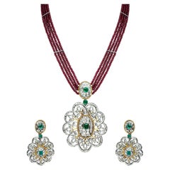 18 Karat Gold Ruby Set with Diamonds and Emeralds