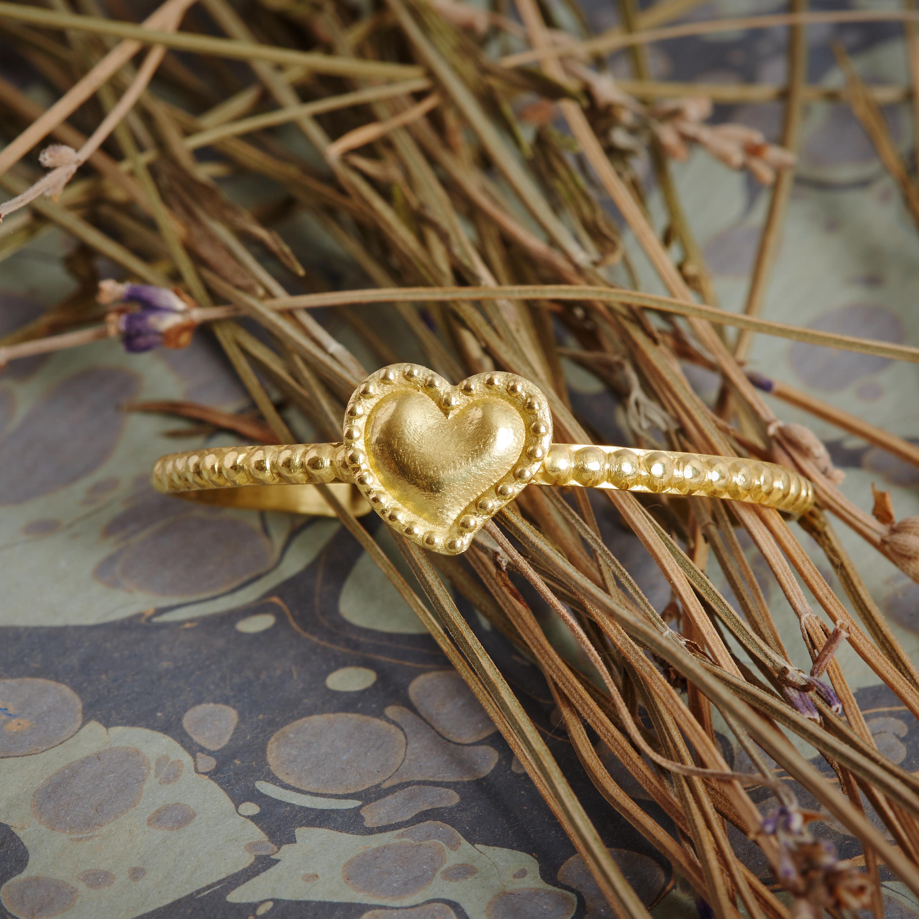 Handcrafted 18 karat gold solid sacred heart cuff

Symbolism:
The sacred heart symbolises eternal, undying love and devotion

Materials:
18 karat gold

If this item appears to be out of stock, we can order another piece for you. Please note that the
