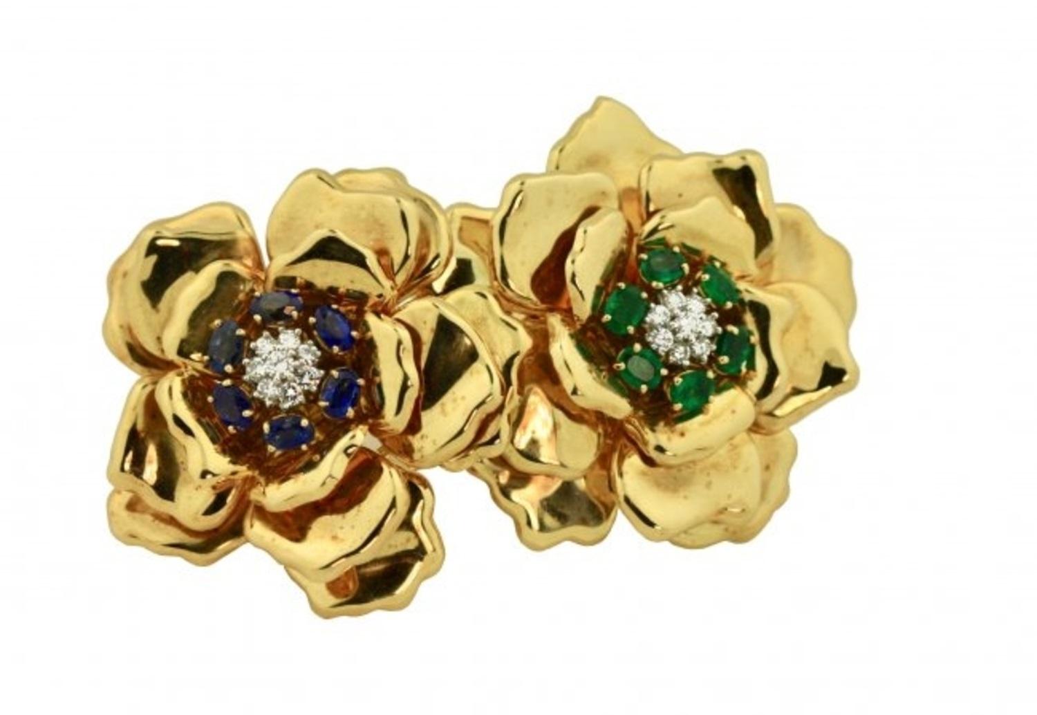 
18 Karat Gold Sapphire and Diamond Brooch, Emis
The flowerheads with centers set with Sapphires and Emeralds, accented by round diamonds, signed Emis
Sapphires and Emeralds together weighing approx. 5.50 cts.
Diamonds weighing approx. .75 cts.
87.6