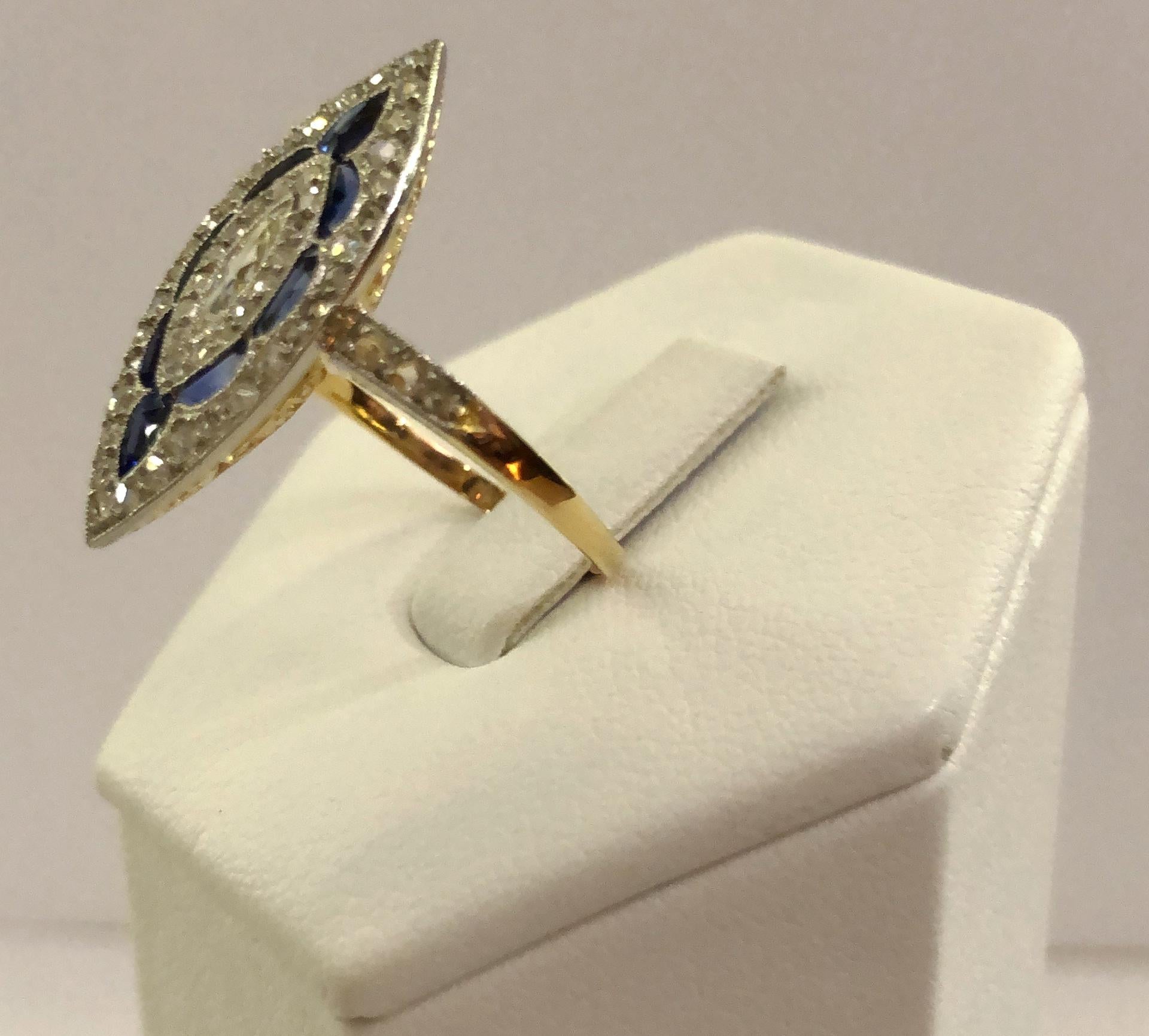 Vintage 18 karat gold Figaro model ring, with a central large diamond of 0.2 karats and surrounding sapphire and diamonds on the contour, Italy 1890-1920s
Ring size US 6.5-7