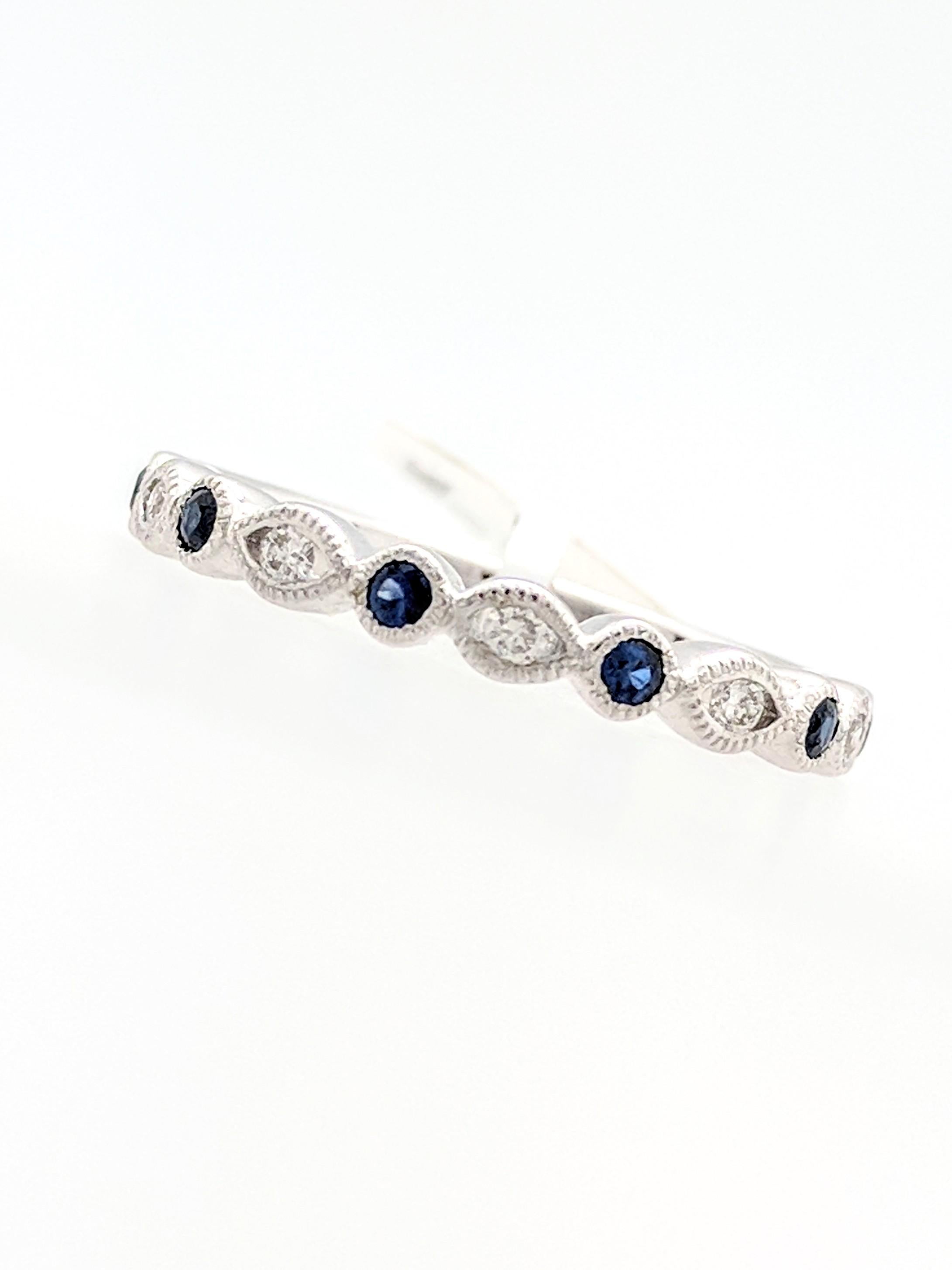 You are viewing a Beautiful Sapphire & Diamond Stackable Band. This ring is crafted from 18k white gold and weighs 3 grams. It features (6) natural round blue sapphires for an estimated 0.19tcw and (5) natural round brilliant cut diamonds for an