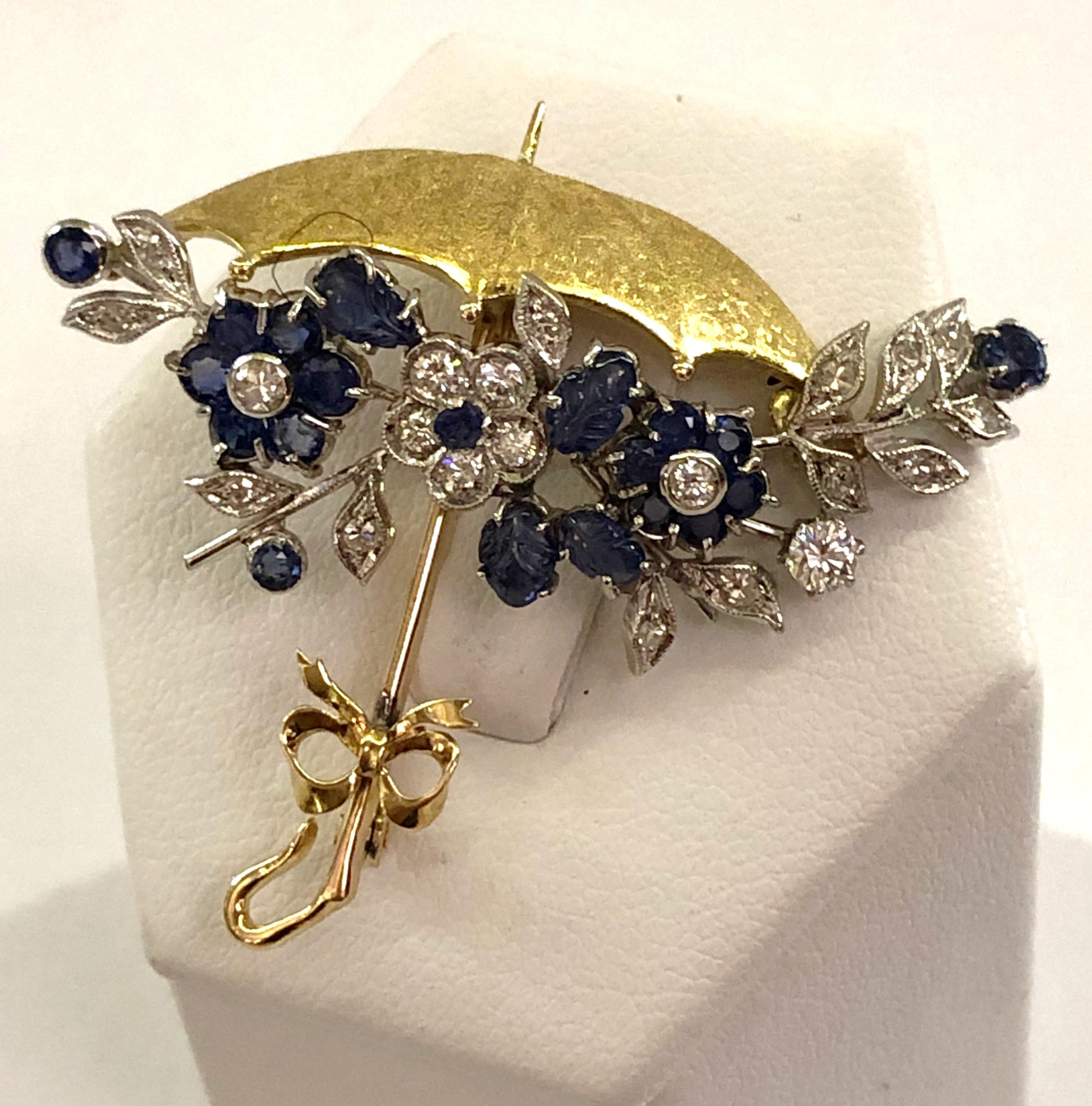 Vintage umbrella brooch with 18 karat yellow and white gold, with sapphires and brilliant diamonds, Italy 1950s 
Length 3.6cm