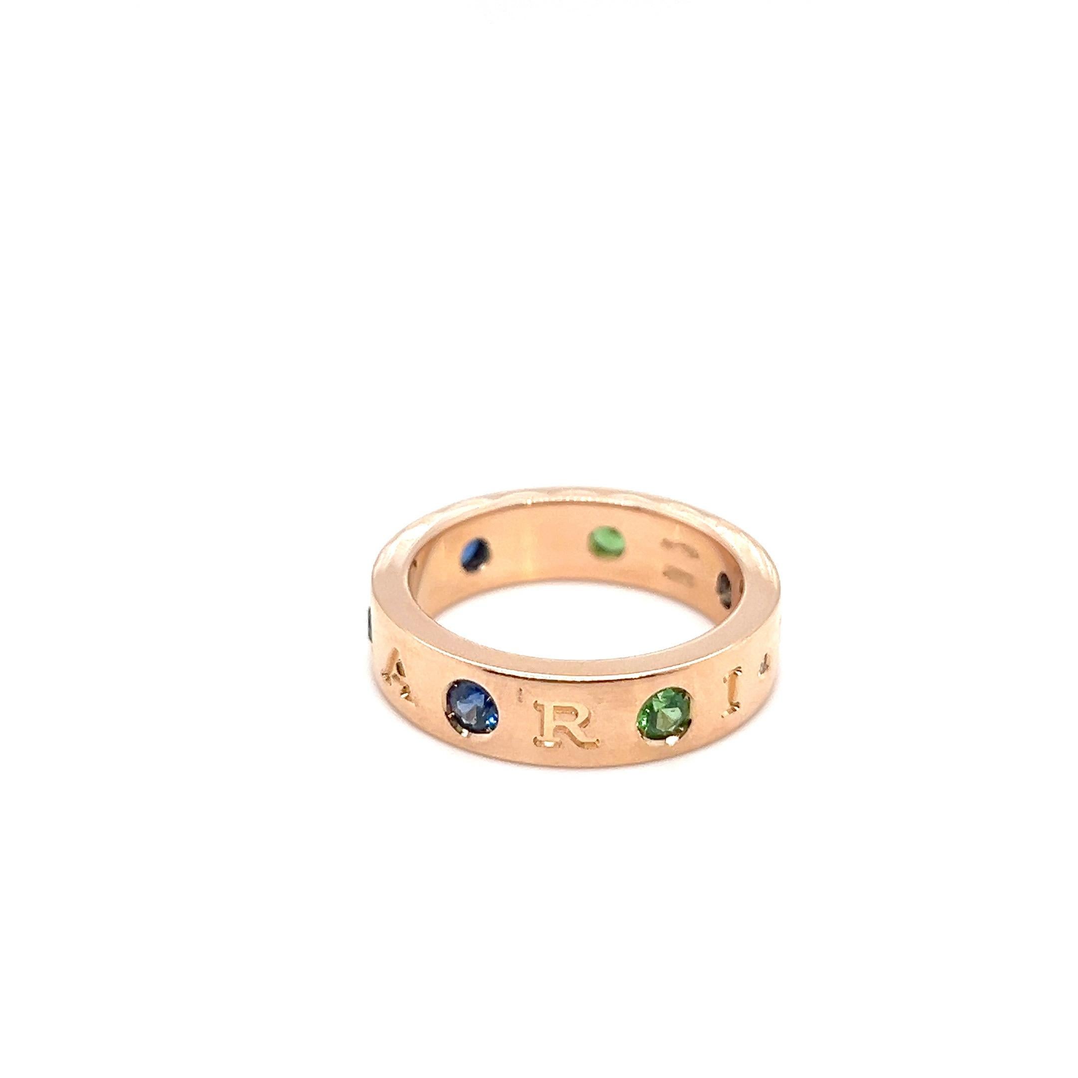 Delightful 18 karat pink gold, sapphire, tsavorite and diamond band ring by renowned Italian brand Bvlgari.

Crafted in 18 karat pink gold, this modern band ring is decorated with 3 round sapphires, 3 round tsavorites, 1 small brilliant-cut diamond