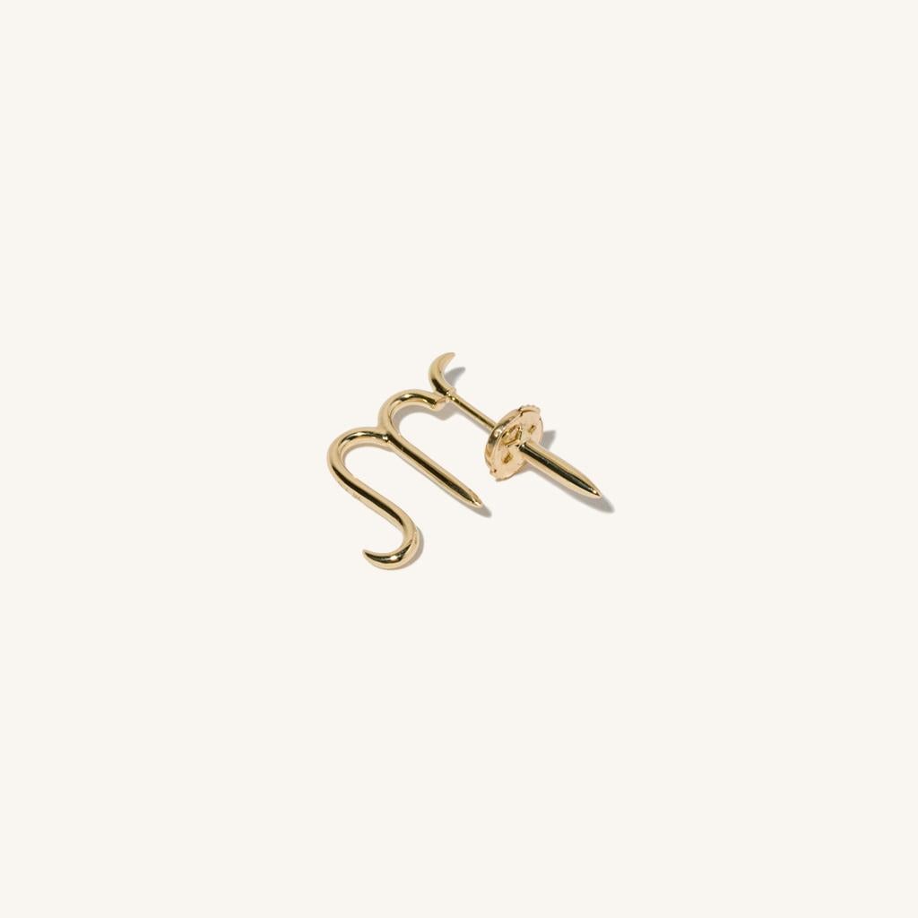 Zodiac inspired items are special items that have long been said to be auspicious. MILAMORE's zodiac motif earrings take form in 18 karat yellow gold to create an abstract shape that looks good on everyone. With a 360-degree design that differs