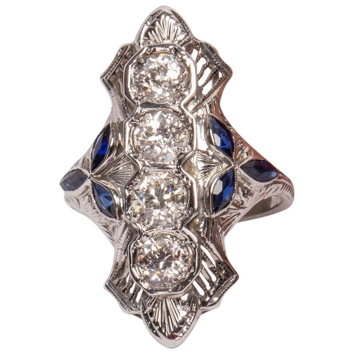 18 Karat Gold Shield Ring with 4 Old Euro Cut Diamonds w/ Tris of Blue Sapphires