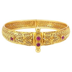 18-karat Gold solid bangle with ruby 