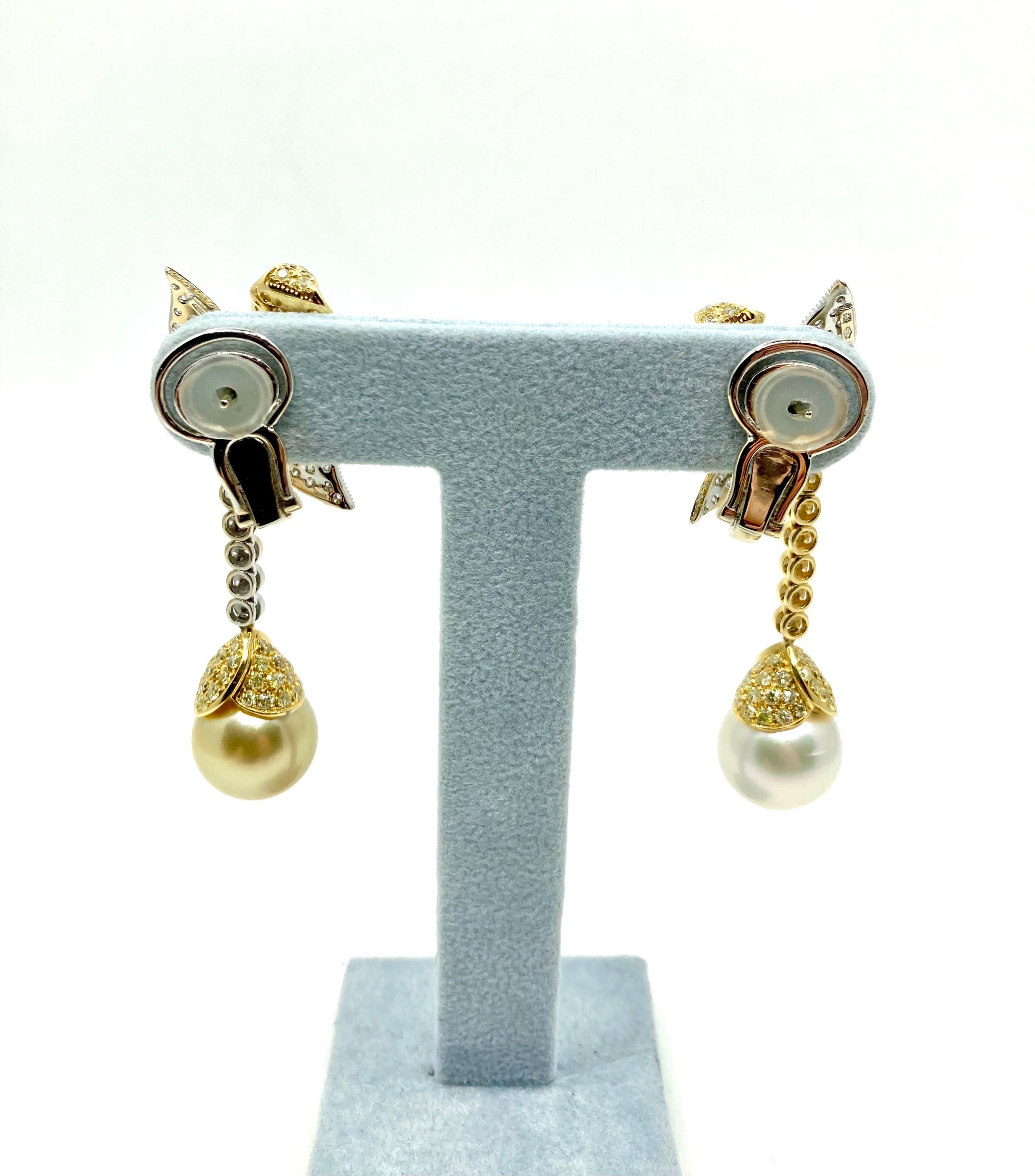 Timeless elengat Yellow and White Gold earrings, with a White South Sea Pearl (diameter 14.50 mm), a Yellow South Sea Pearl (diameter 14.30mm), White Diamonds ct. 1.48 and Yellow Diamonds ct. 4.63, Made in Italy by Roberto Casarin. 

A unique piece