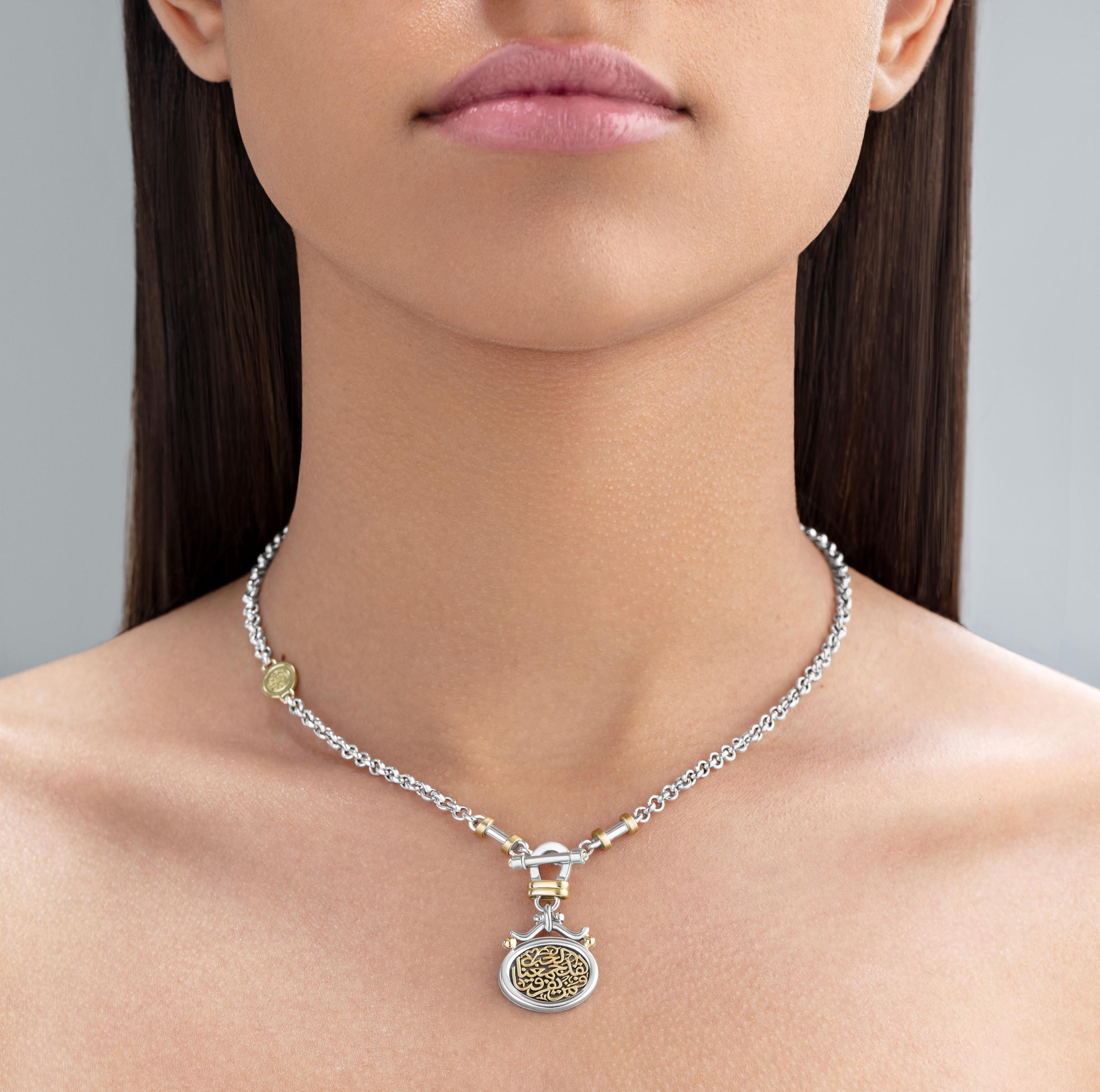 18 Karat Gold and Sterling Silver Classic Calligraphy necklace adorned with Pearls. 

Azza Fahmy's signature T-Lock necklace adorned with 0.05gm Pearl T-Lock end stones and the love words of Gibran Khalil Gibran - 'لقد جمعنا الحب فمن يفرقنا' , which