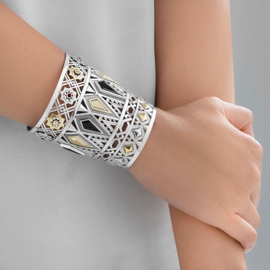 18 Karat Gold and Sterling Silver hand-pierced cuff inspired the mosaic marble panels of the Mausoleum of Sultan al-Mansur Qalawun in Cairo, set with semi- precious stones.

In the Mausoleum of Sultan al-Mansur Qalawun - built in 1285 and the first