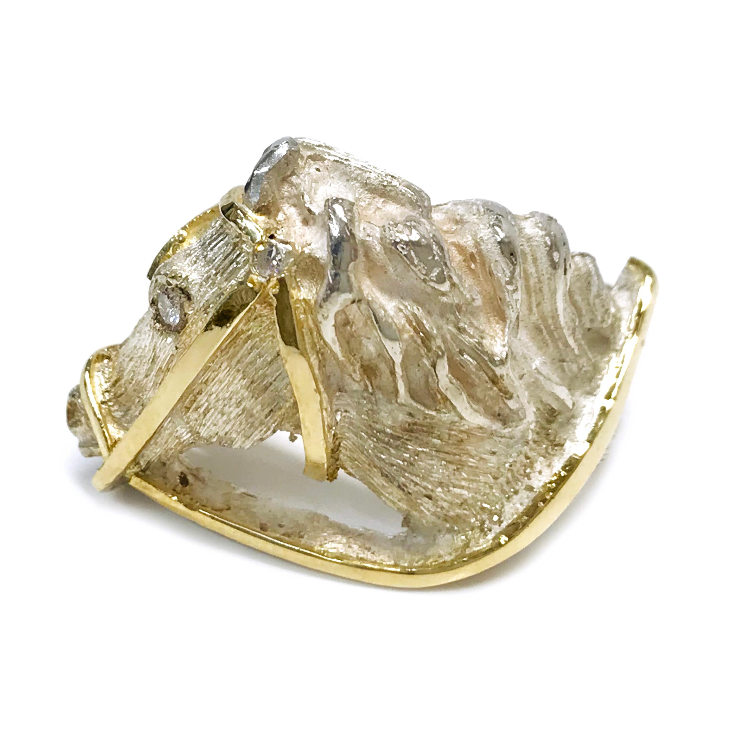 Two-Tone 18 Karat Yellow Gold and Sterling Silver Horse Head Ring. Hand-carved horse head with a textured finish and smooth gold reins. This ring would be perfect for an equestrian lover or any person that appreciates these majestic animals and