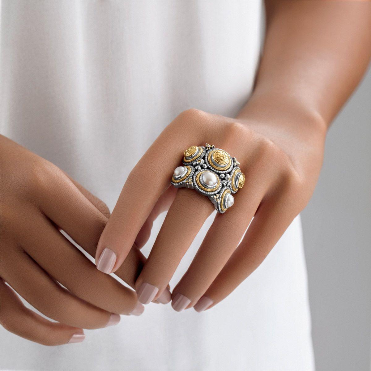 18 Karat Gold and Sterling Silver ring inspired from old tribal jewelry adorned with 0.67 carat pave-set White Diamonds, 0.25 carat Champagne Diamonds and 2.10 gram Pearls, inscribed with 