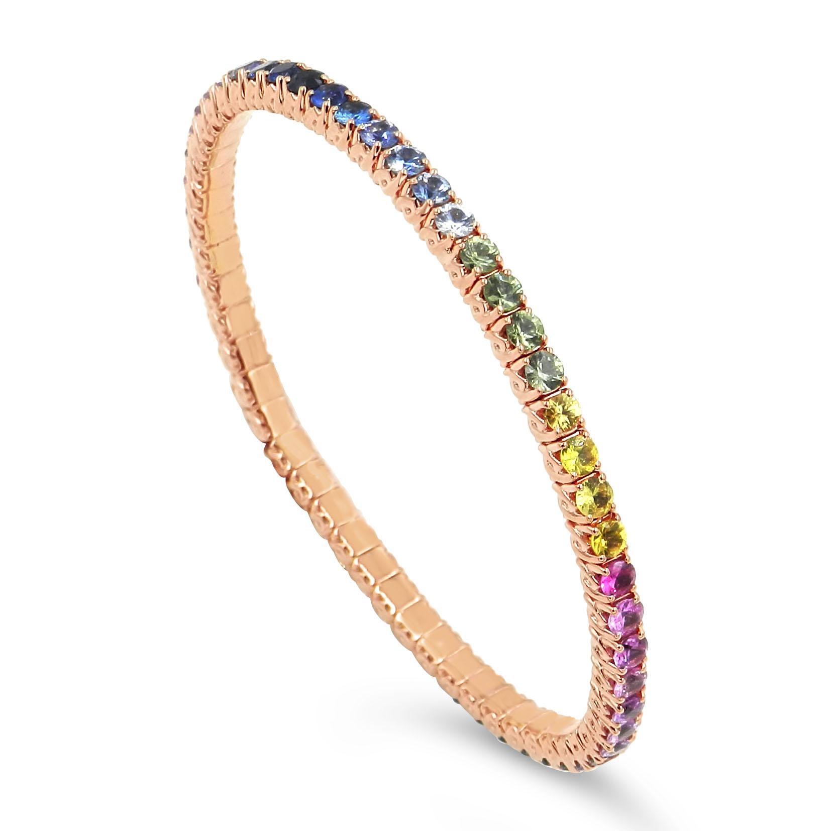 18KT  Gold  Bracelet with an elastic construction.
A no brain ring, happy, fancy, a comfortable bracelet that stretch over your hand with vibrant rainbow sapphires
The best option to go over your wrist and  comfortably sit on your wrist. In yellow