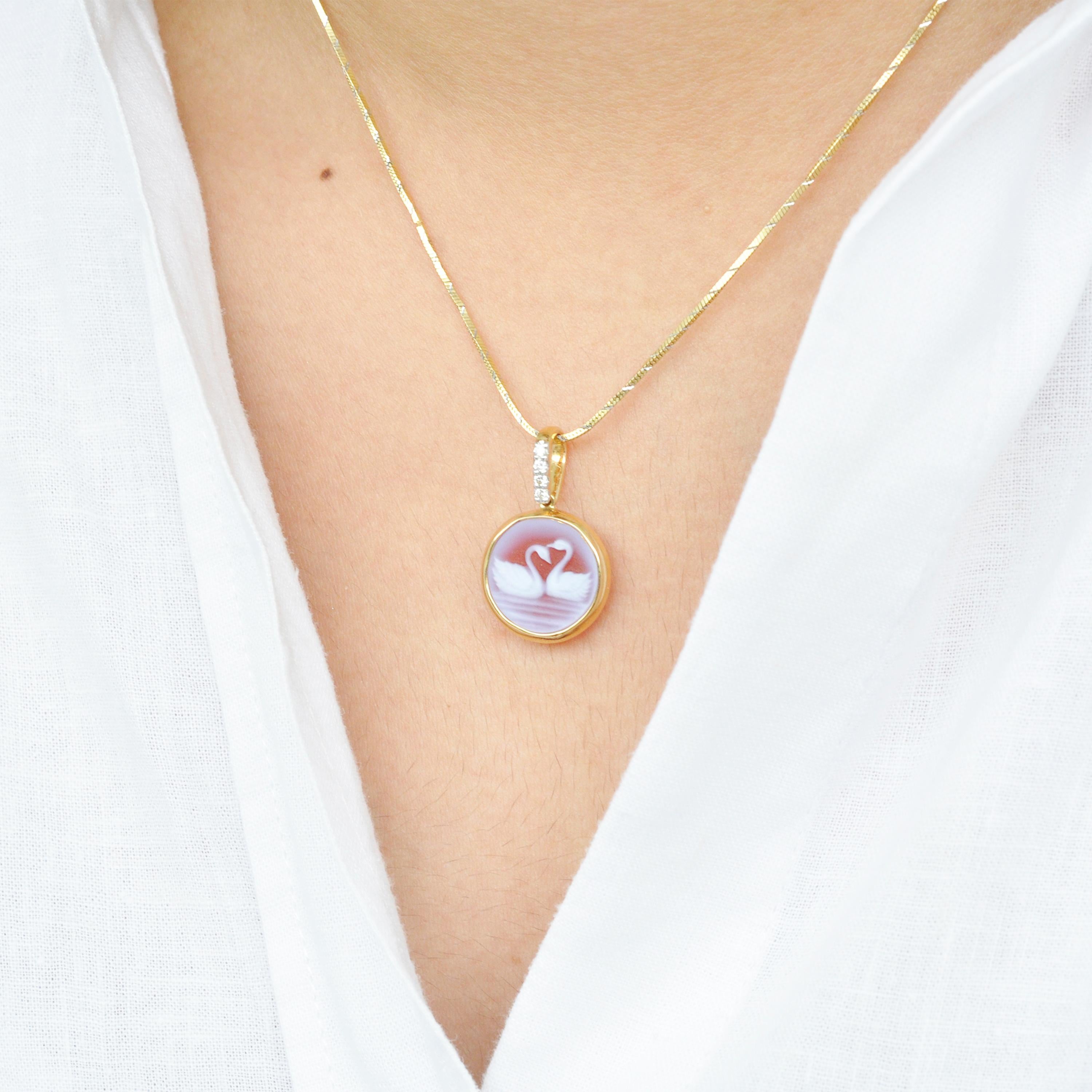 18 karat gold swan natural agate gemstone cameo diamond pendant necklace.

Celebrating love is this beautiful 18 karat gold swan cameo diamond pendant necklace. The pendant is extremely chic and elegant and perfect to be worn everyday. The cameo is