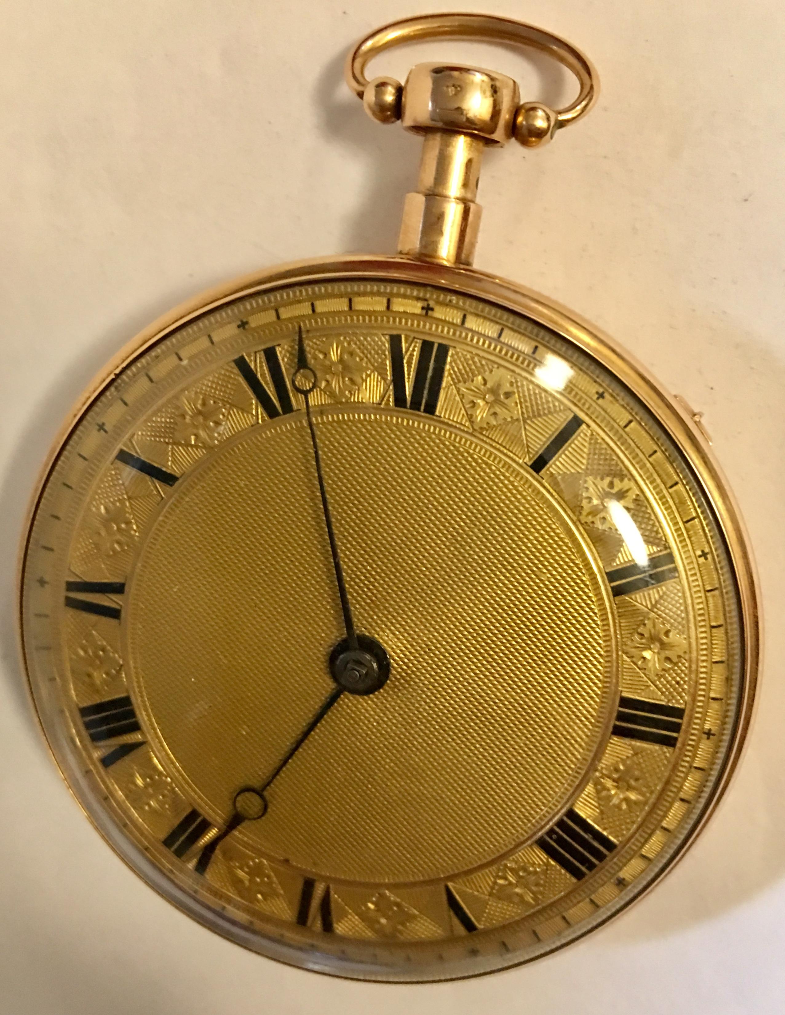 This gorgeous piece is an 18 karat gold verge quarter repeating pocket watch, it has an open face and is key wound. A Very ornate gold dial with black Arabic numerals set on a chapter ring and black steeled hands. It’s 54mm watch diameter and weigh