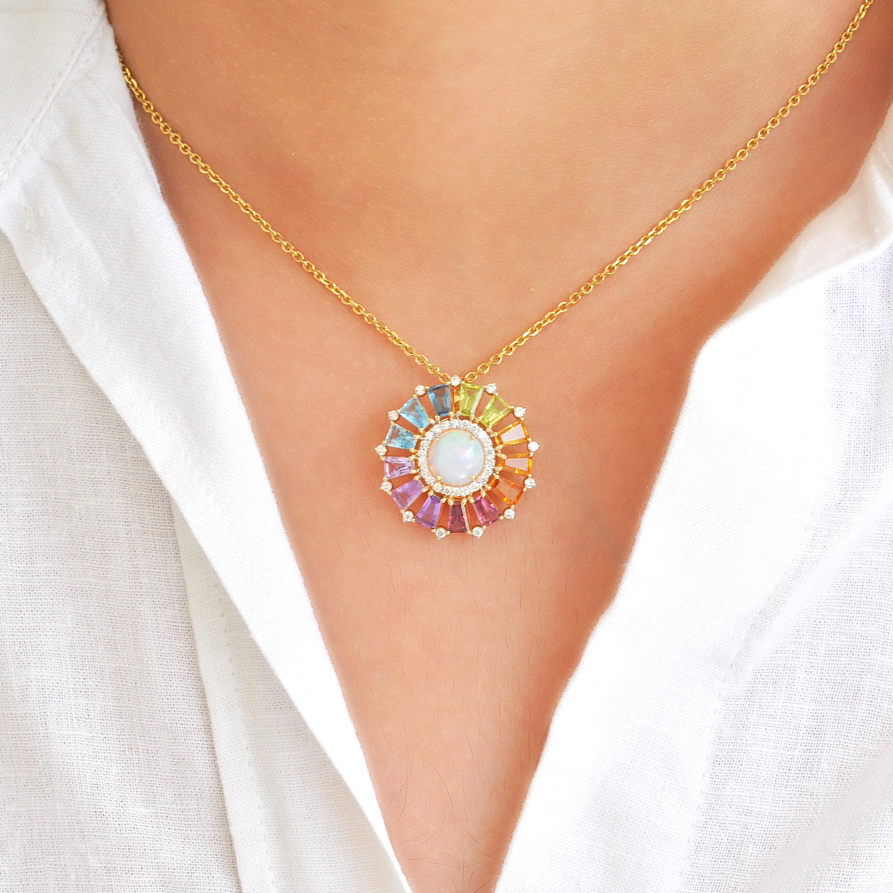 18 karat gold tapered baguettes rainbow gemstones ferris wheel opal diamond circle pendant.

This Ferris Wheel pendant necklace is a mesmerizing blend of color and elegance. Carefully crafted, this necklace features a circle of prong-set rainbow
