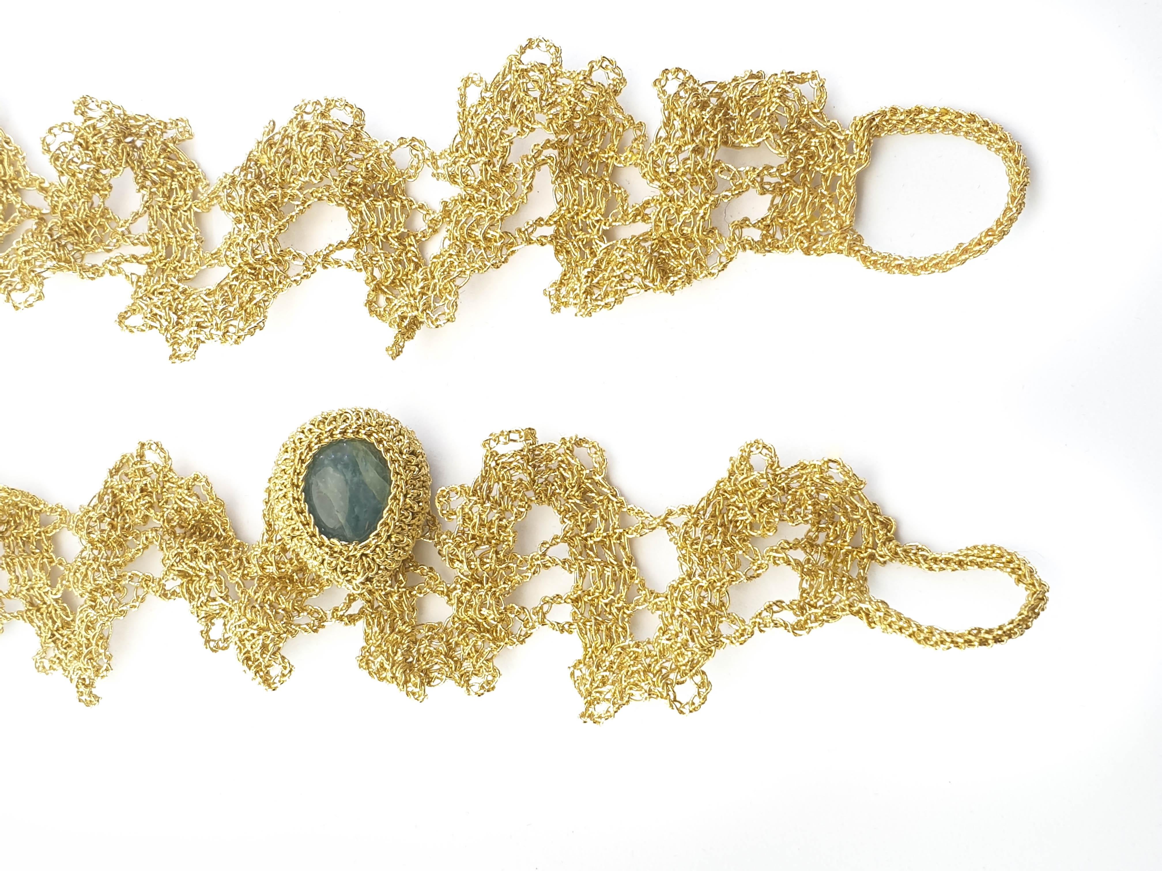 2 Very unique and delicate crochet bracelets. The bracelets are hand crochet with 18 karat gold thread (26.5 grams). One of the 2 bracelets is adorned with a tear shape dark blue milky Aquamarine (weighing 5.23 grams/26.15 carats).

Shenhav's