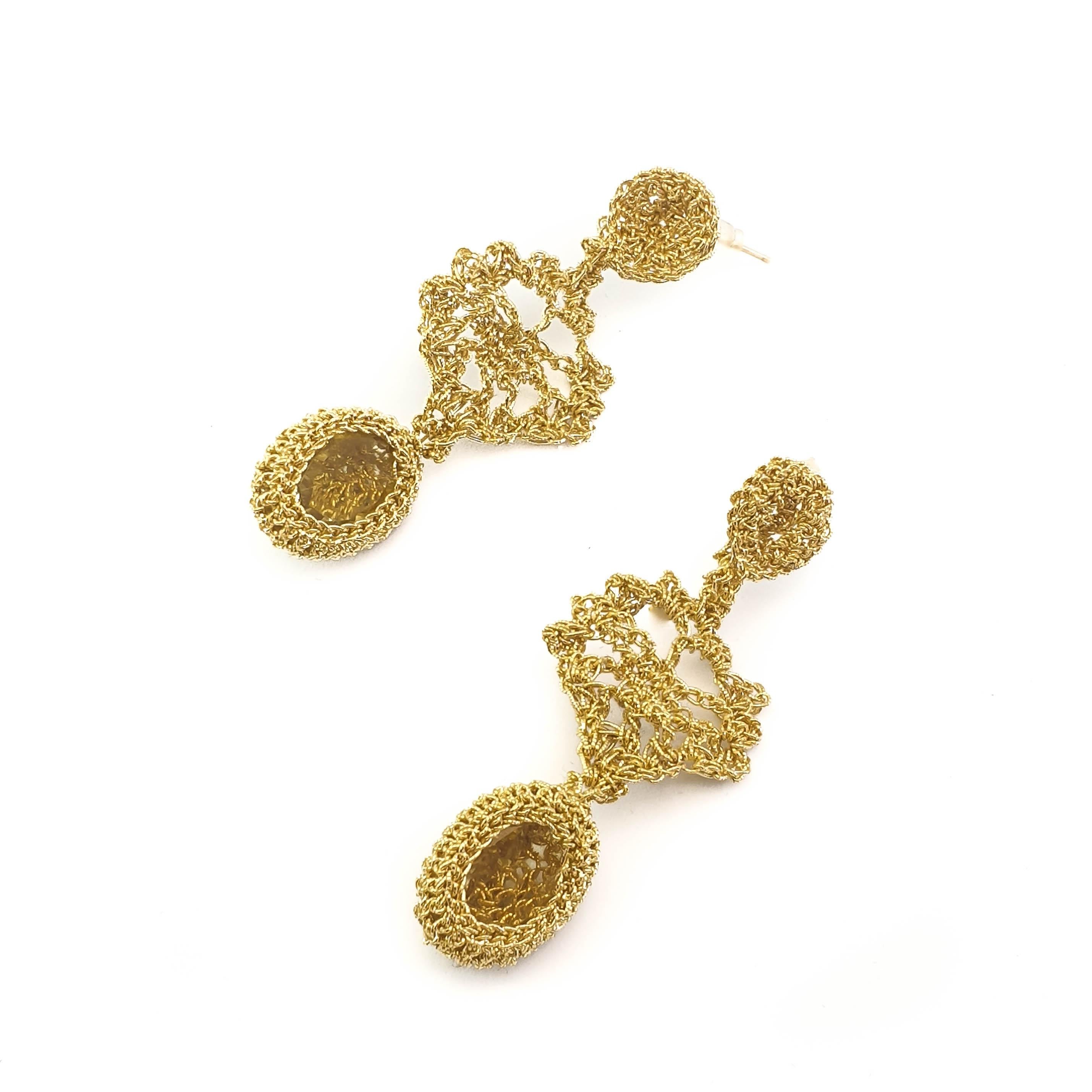 Beautifully crafted hand crochet gold thread  (2.97 grams gold) earrings with light golden citrines (weighing 2.3 grams/11.5 carats). The intricate stitching can be seen through the stones.

Shenhav's inspiration comes from the world's wide-open