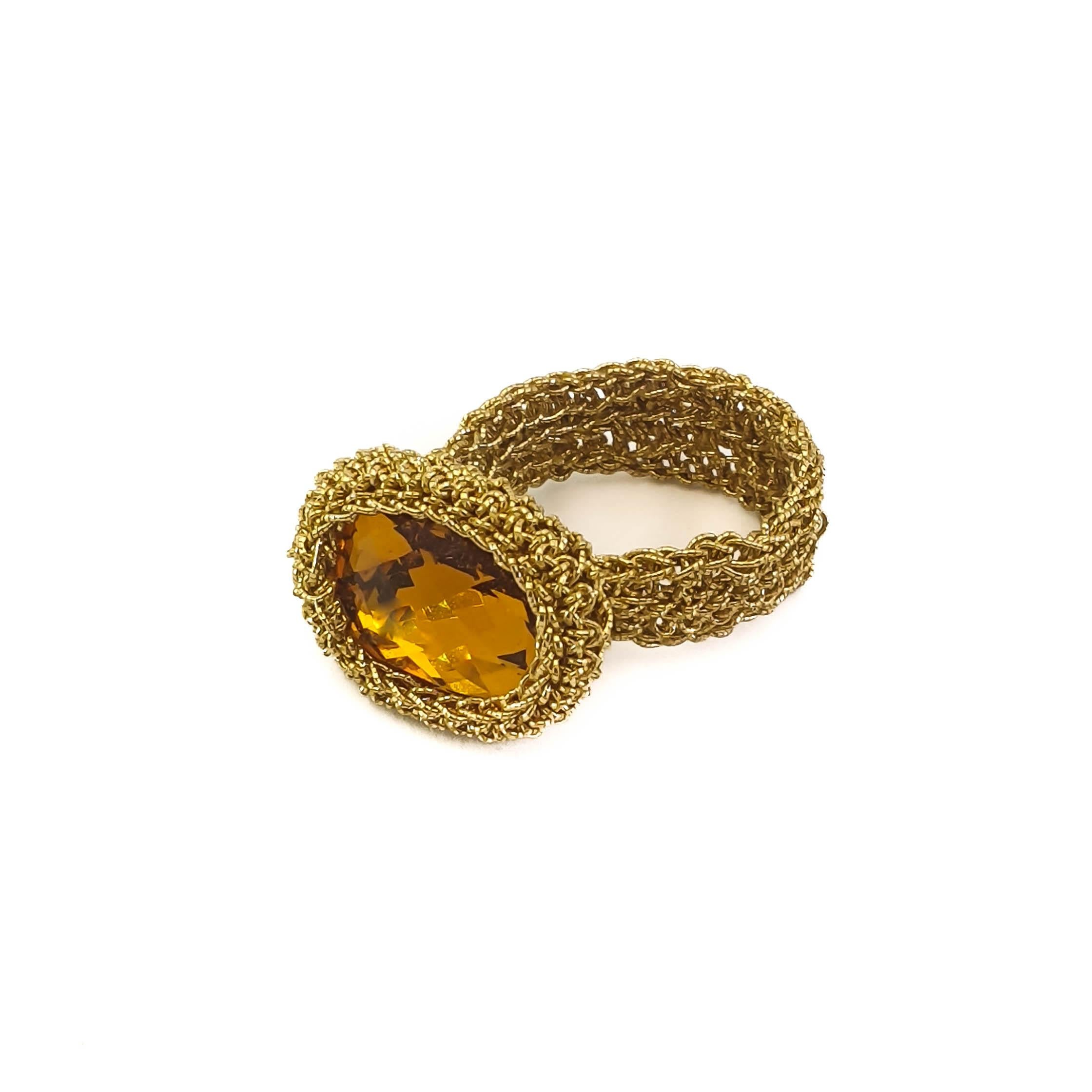 Delicately crafted hand crochet gold thread ring with a lovely vintage amber Swarovski Crystal. This ring is a US size 6. It can be stretched a little to fit a larger size. This ring can be custom made with different Swarovski Crystals.

Shenhav's