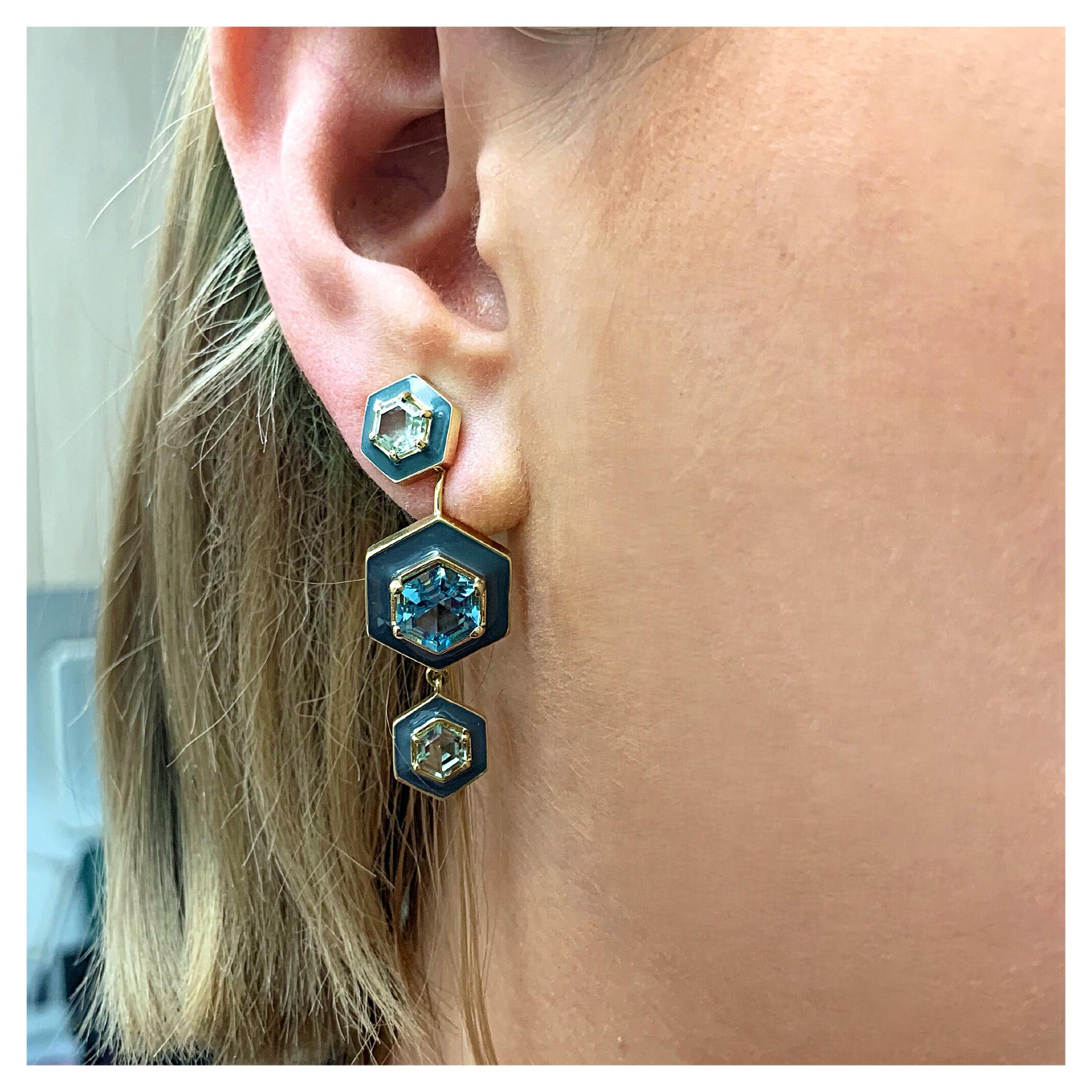 Gorgeous custom cut green and blue topaz in modern, geometric shapes, are surrounded by a frame of dark grey enamel.  These earrings are statement making with strong color and form.  They work well with casual clothes, yet can be elegant for