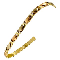 18 Karat Gold Tri Tone Hugs and Kisses XO Link Bracelet