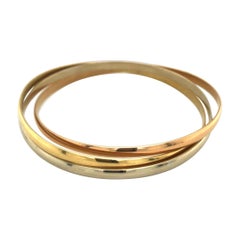 18 Karat Gold Trinity Bangle by Cartier