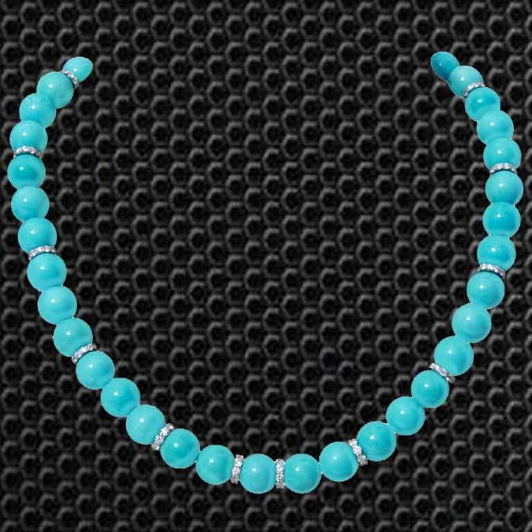 A single strand Turquoise Necklace, which consist 292.19 carats Turquoises and includes 3.97 carats Round White Diamonds. The necklace is made in 18K White Gold and weighs approximately 10.818 grams. The clasp is also made of 18K Gold.