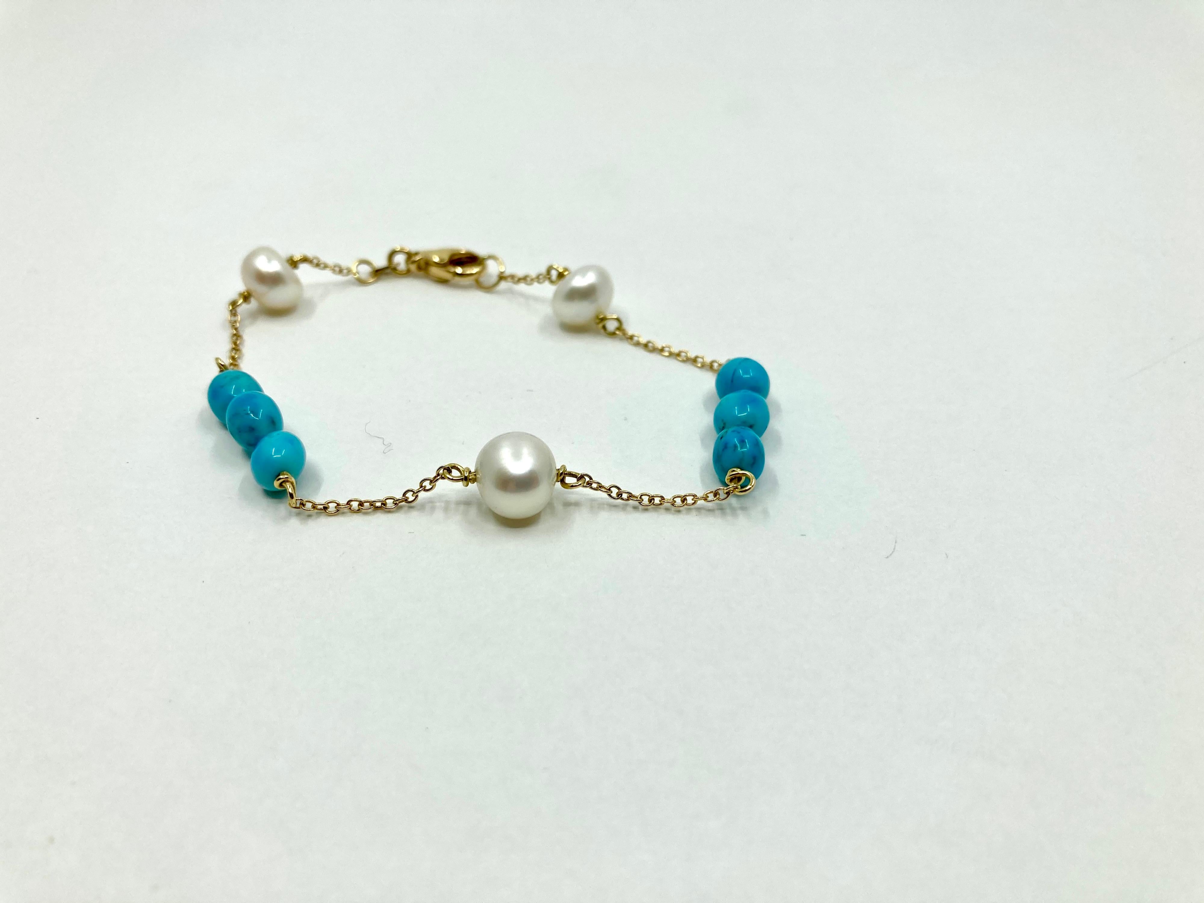 Timeless Yellow Gold Bracelet, with Pearls and Turquoise, Made in Italy by Roberto Casarin. 

A casual yet refined look, the lavish turquoise color and the pristine pearls, on a yellow gold chain, complete a wondeful design, perfect for a summer