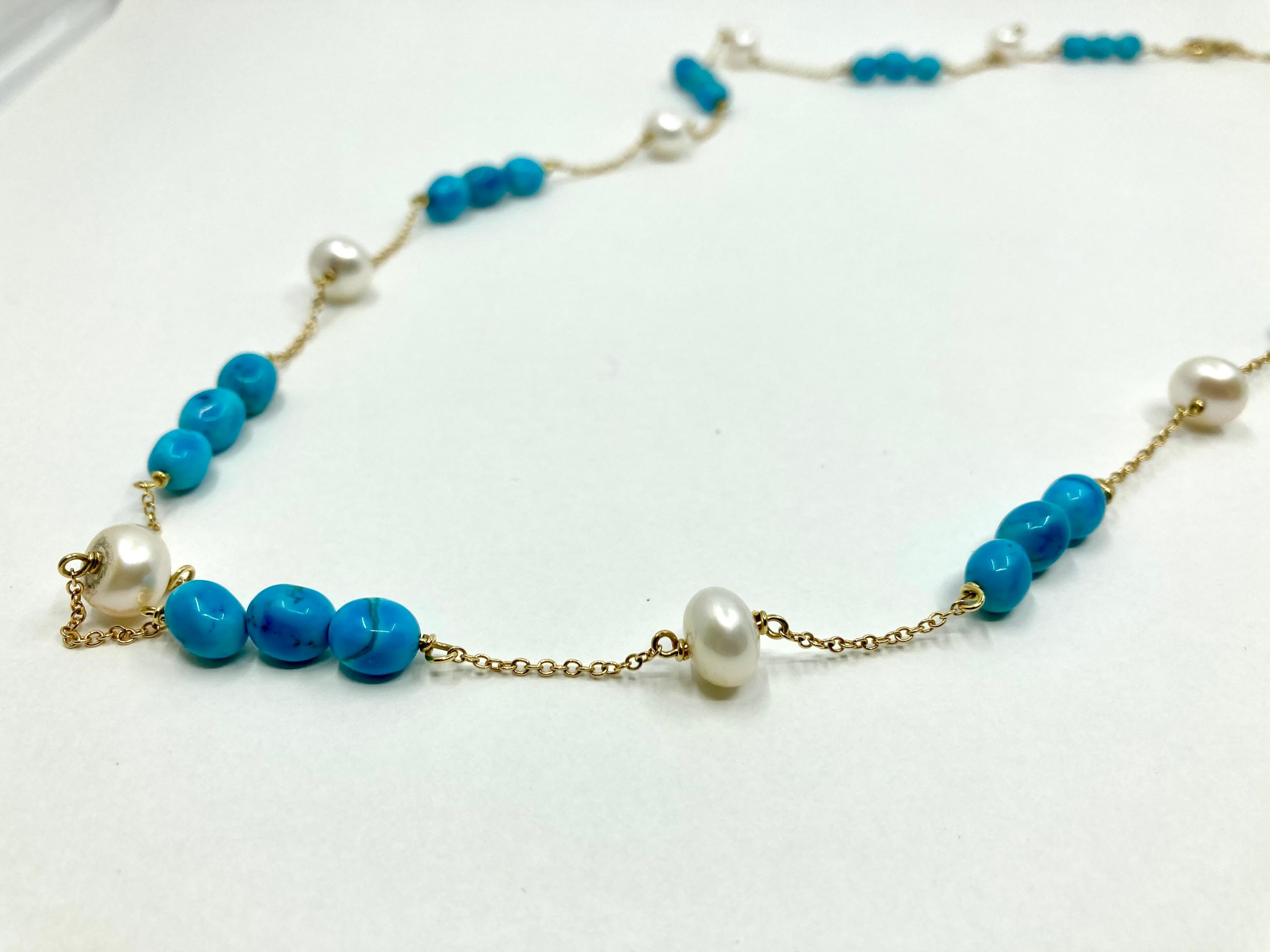 Timeless Yellow Gold Necklace, with Pearls and Turquoise, Made in Italy by Roberto Casarin. 

A casual yet refined look, the lavish turquoise color and the pristine pearls, on a yellow gold chain, complete a wondeful design, perfect for a summer
