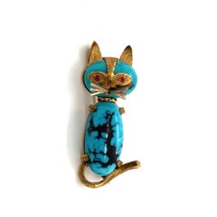 18 Karat Gold Turquoise and Ruby Cat Pin Brooch by Cartier, circa 1960s