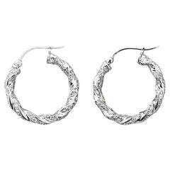 18 Karat Gold Twisted Diamond Earrings
