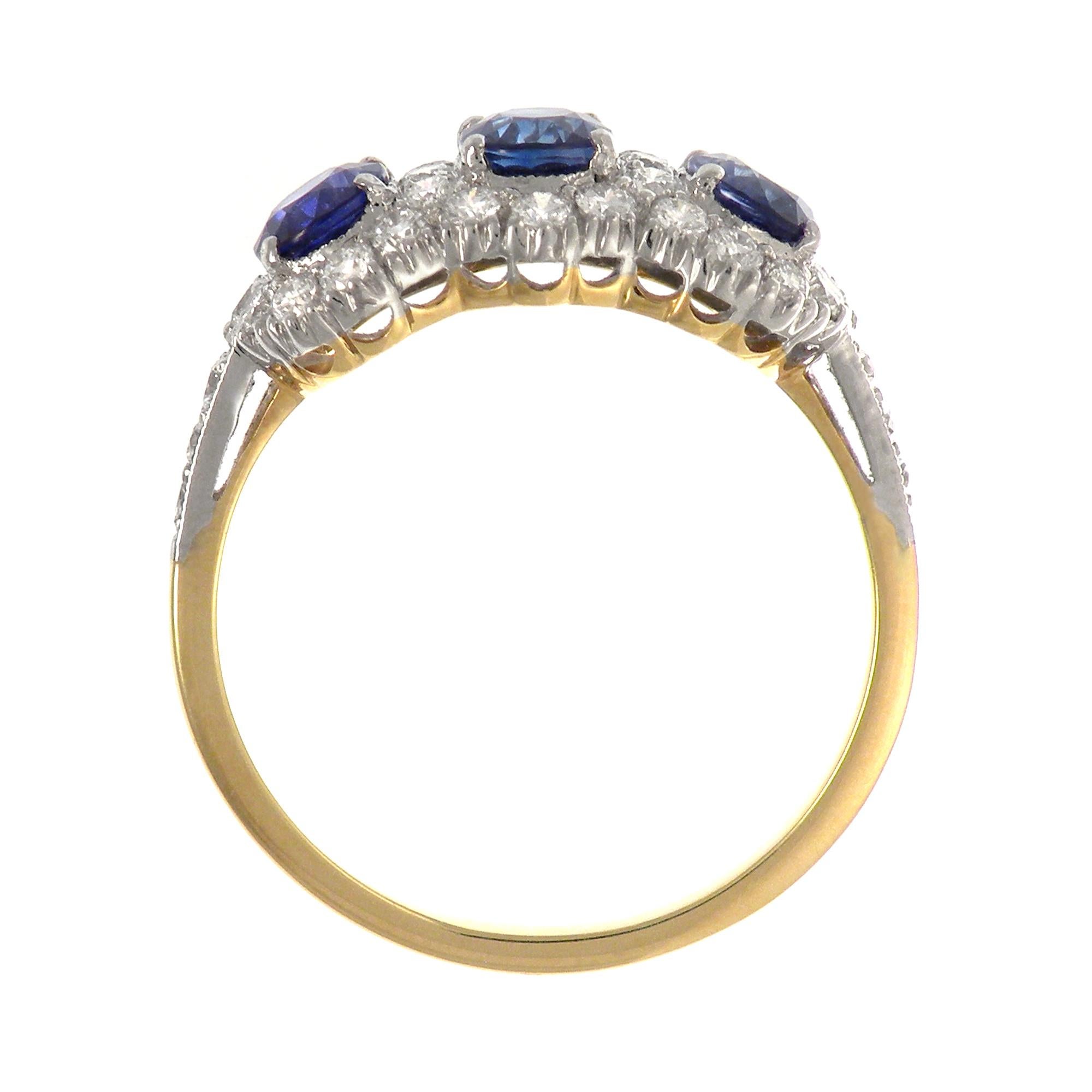 A classic beautiful sapphire and diamond ring, feature with three Blue Sapphire Oval weight 1.67 Carat in total.  Encircled in a single Halo of White Round Diamond 0.62 cts. in 18K Gold two tone setting.

Ring size: 7.5