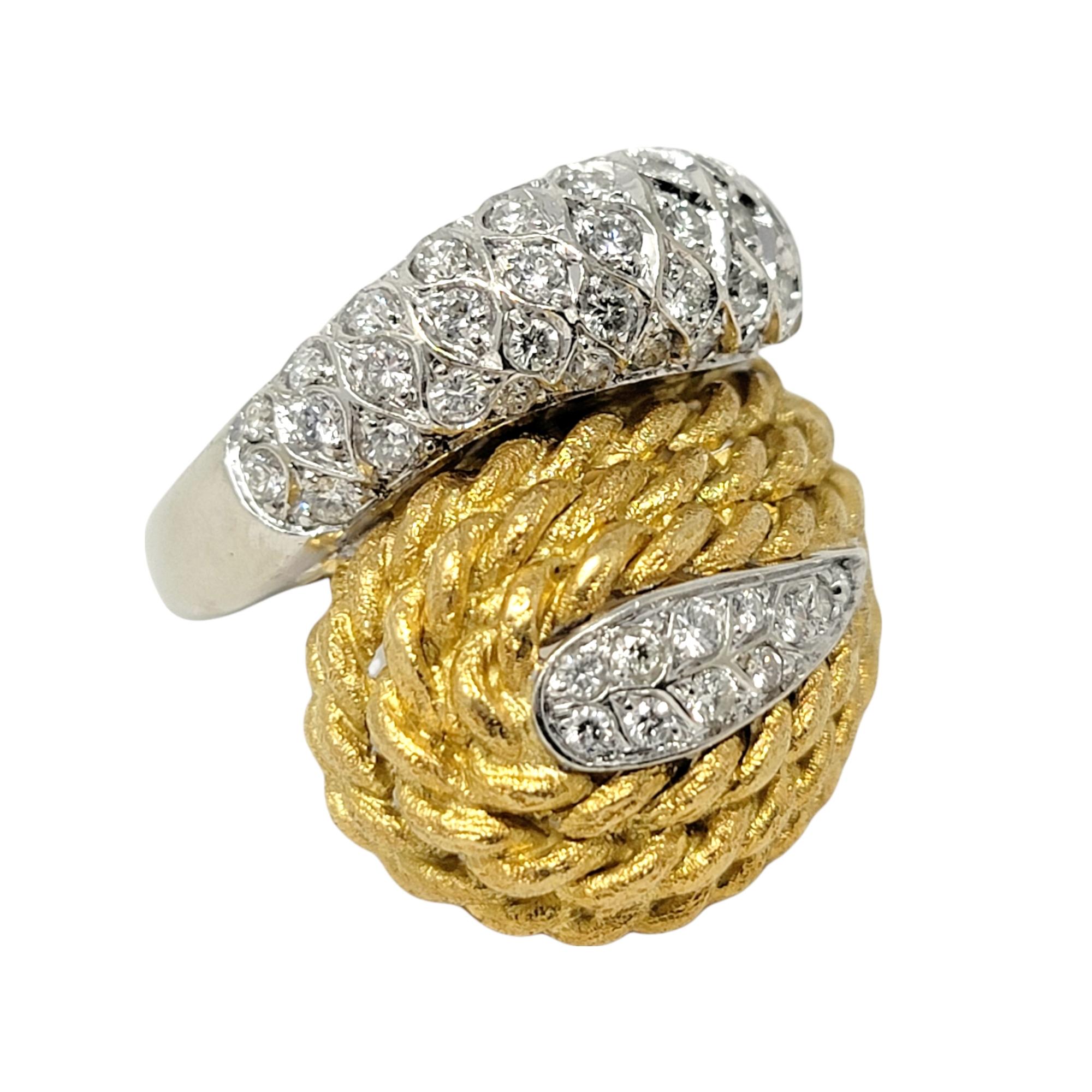 Ring size: 5.25

Stunning contemporary wrap style ring in two-tone gold with glittering diamond detail. 

Ring size: 5.25
Weight: 15 grams
Diamonds: 1.00 ctw
Diamond cut: Round Brilliant
Diamond color: F-G
Diamond clarity: VS1-VS2
Dome length: 23