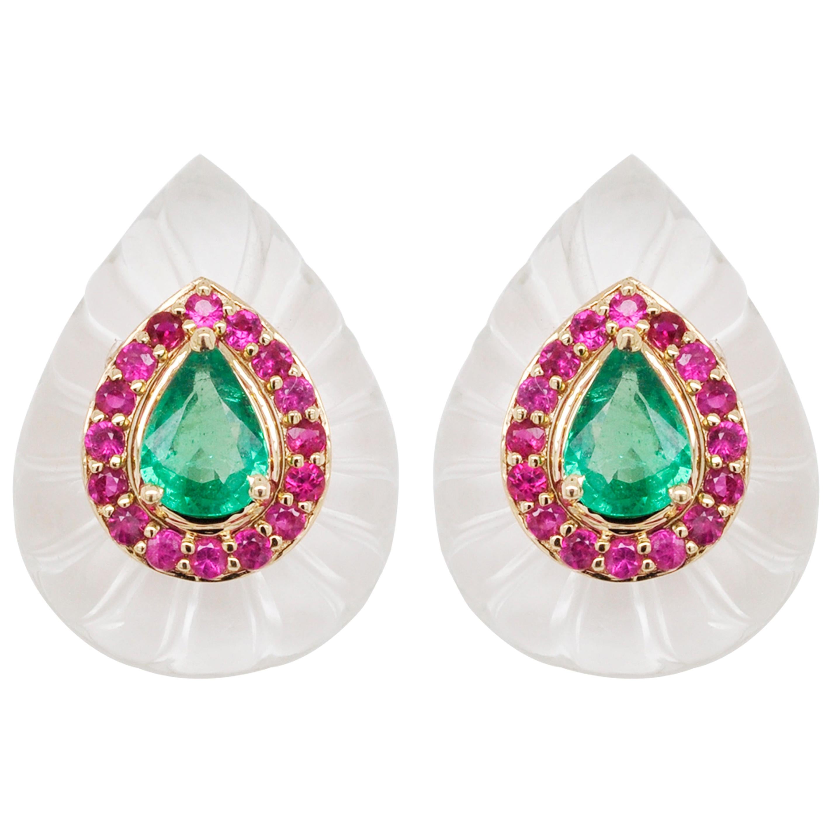 Inspired by the mughal era, presenting 18 karat yellow gold white quartz crystal carving pear emerald ruby stud earrings. 
Pear shaped crystal carving with evenly spaced grooves is the hero in these studs. To accentuate its beauty, an array of round