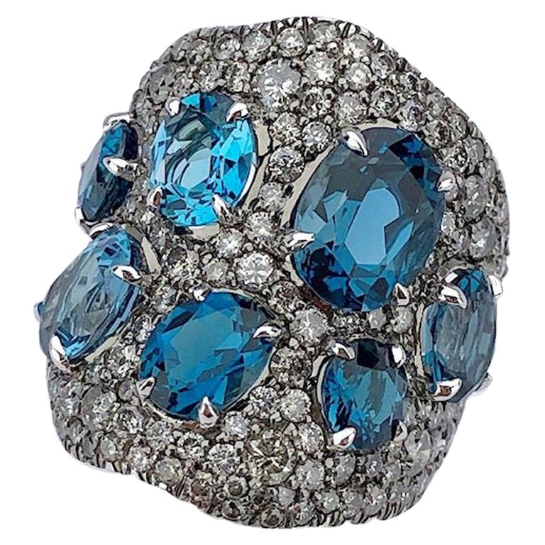 18 Karat Gold Wide, 3.45ct Silver Grey Diamond & 8.20 Carat Blue Topaz Wave Ring For Sale
