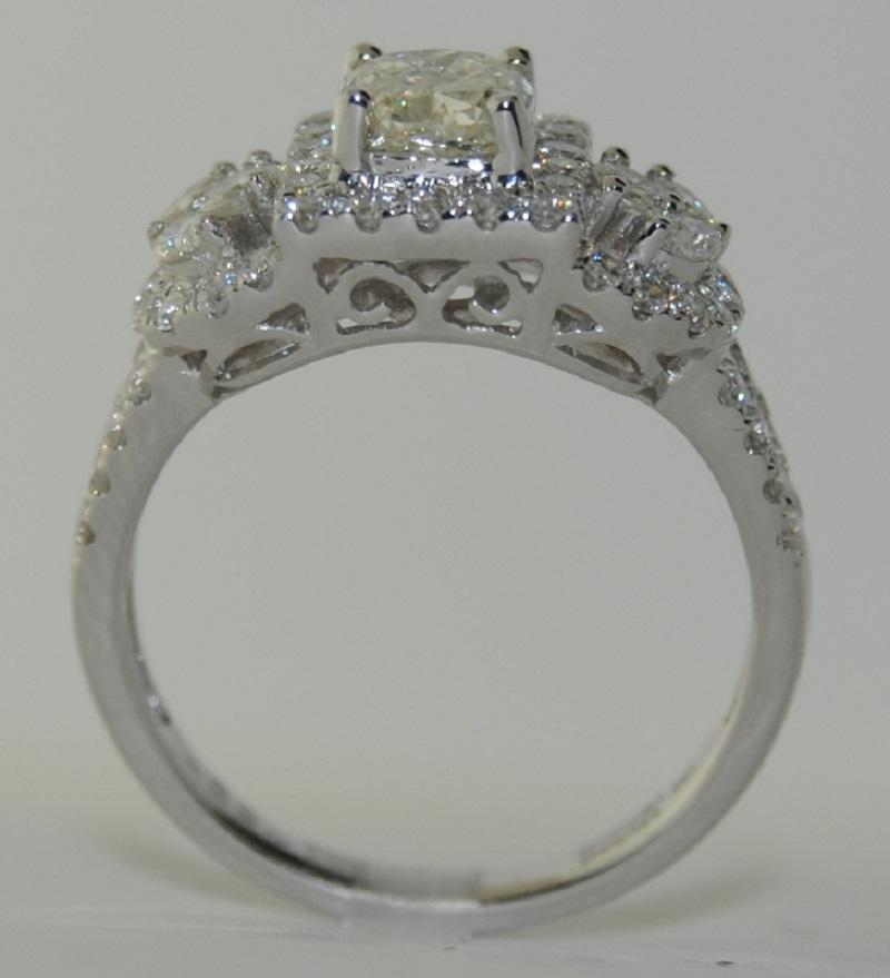 Wedding Diamond Ring, set with Center Cushion Cut Diamond with Marquise and Round White Diamonds  total weight 1.70 Carats.  The Ring is made of 18 Karat White Gold, Size 6.75.