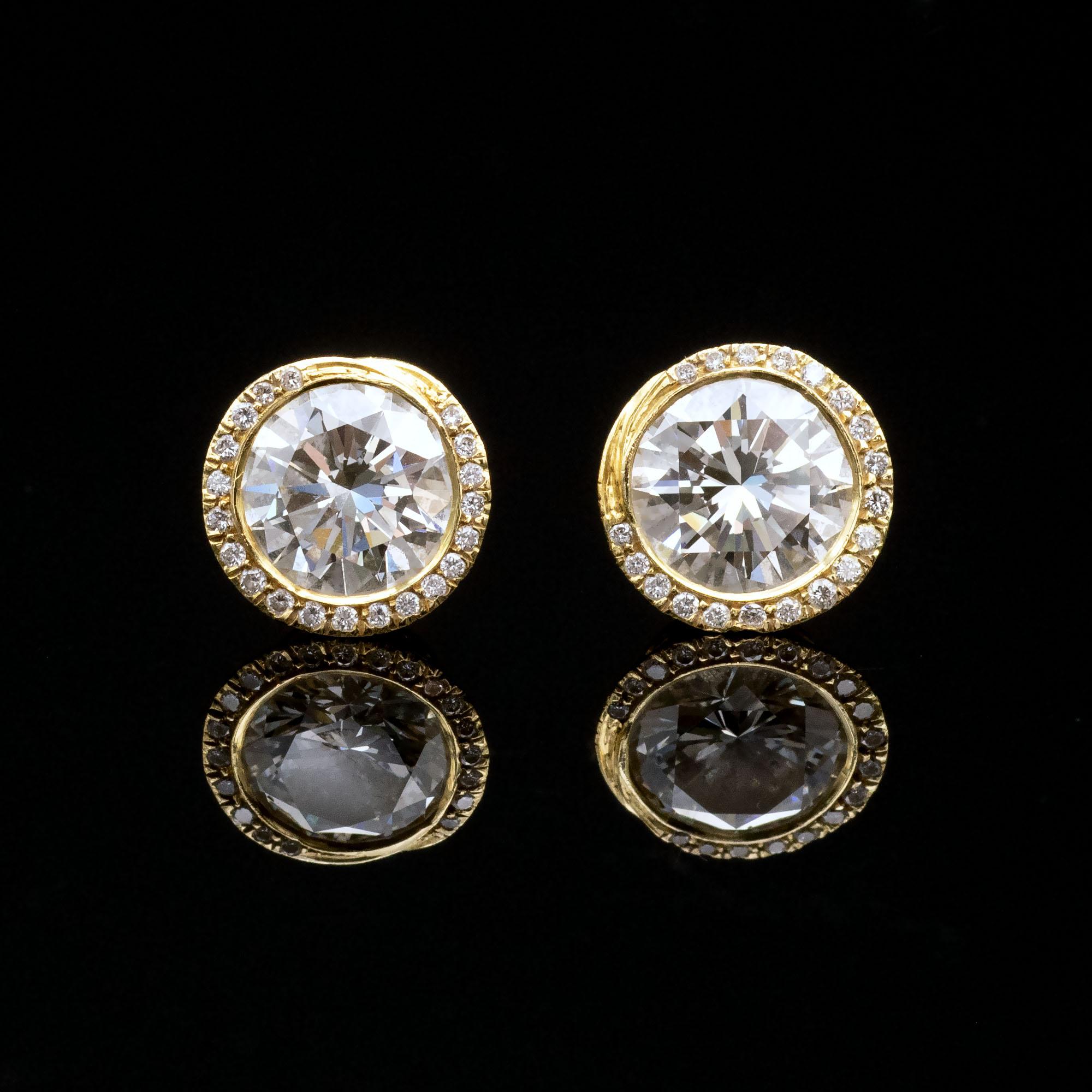 Exquisite nest like 18 karat Gold Diamond stud earrings . These lovely studs are delicately hand made and engraved. Their design although intricate stays simple; it looks like a woven basket holding a round brilliant cut diamond, on its rim a line