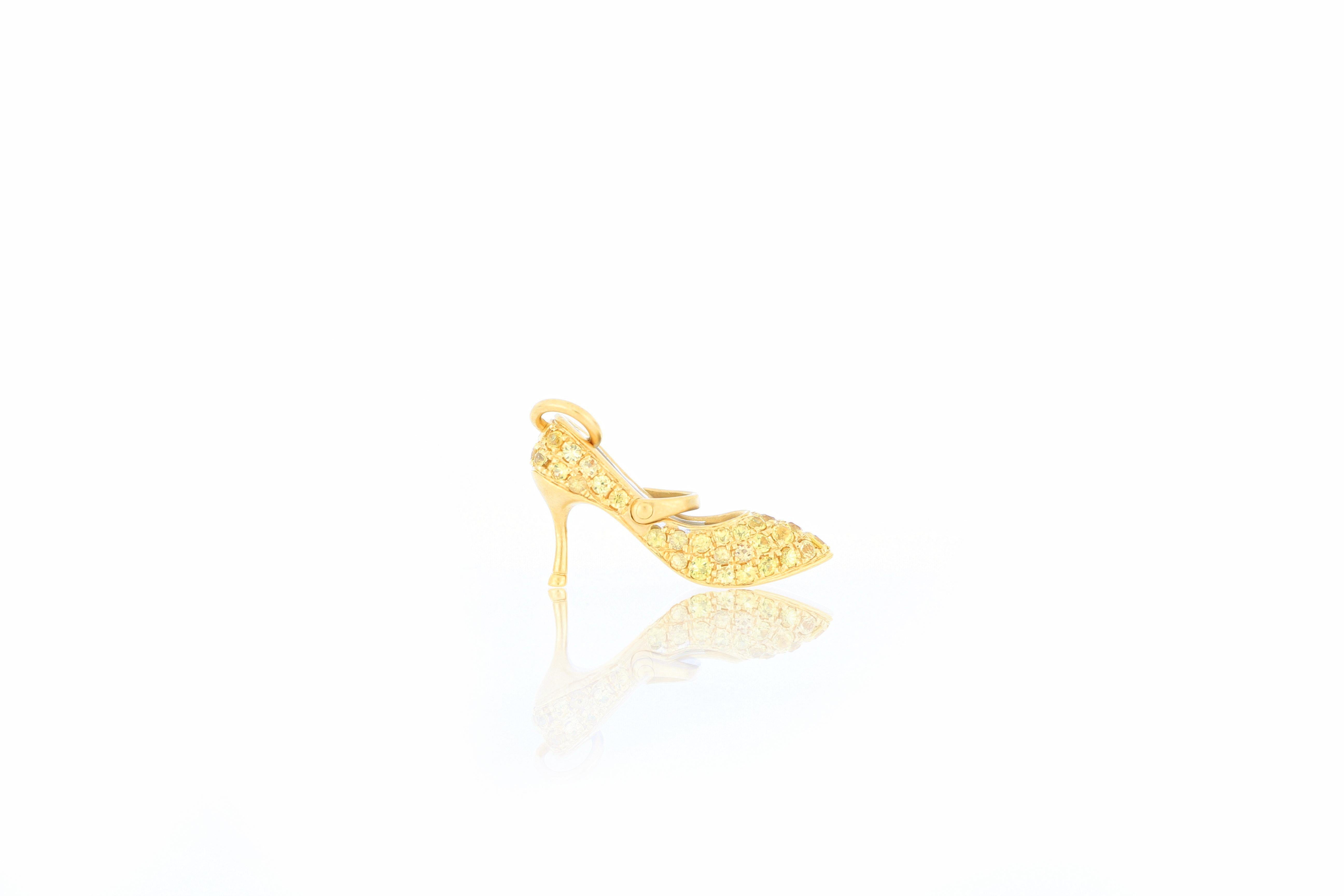 An elegant and very special high heel shoe pendant, set with yellow sapphire  weighing 0.59 carats, mounted in 18 Karat gold. 
O’Che 1867 was founded one and a half centuries ago in Macau. The brand is renowned for its high jewellery collections
