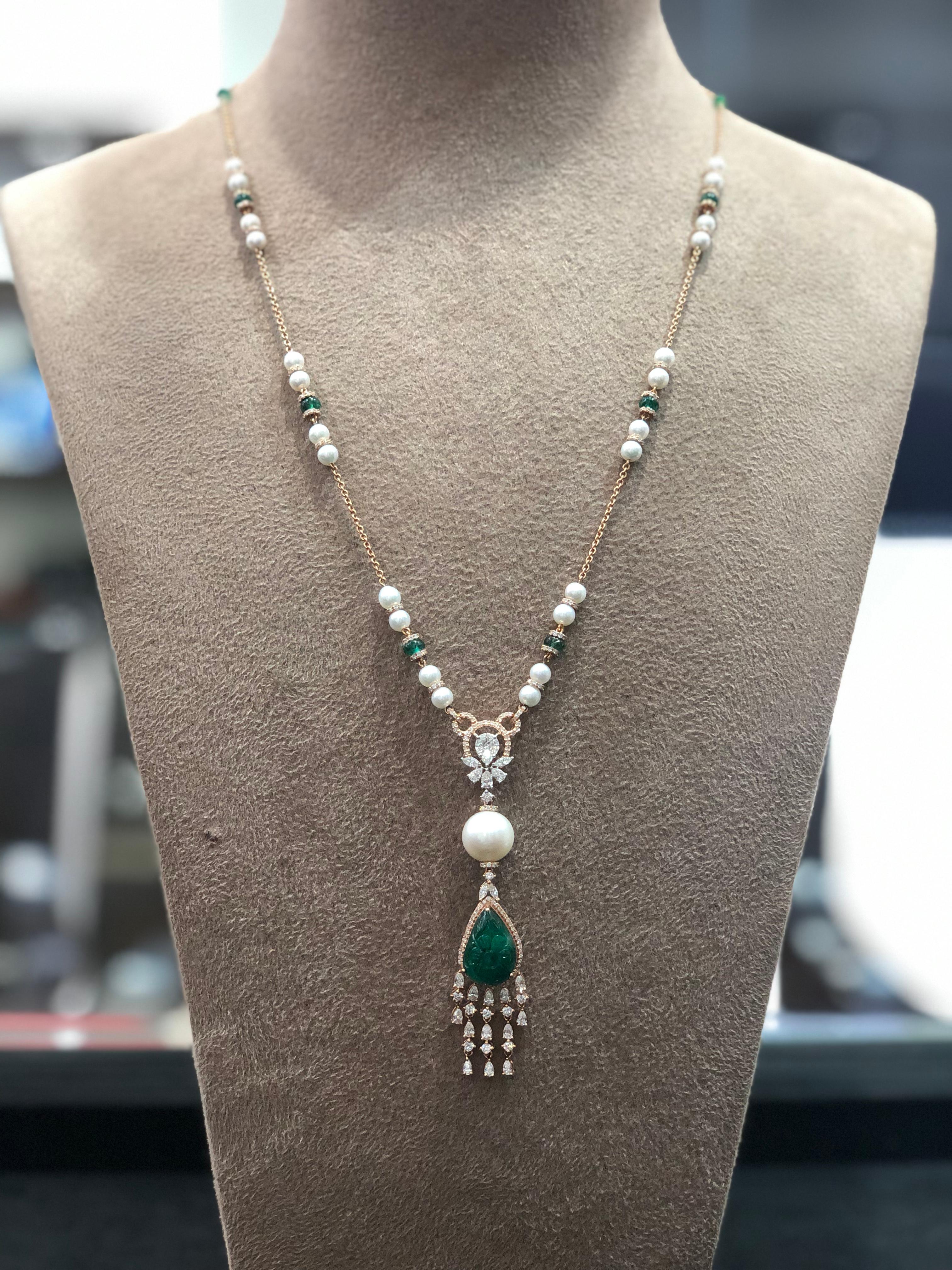 A stunning chain necklace studded with carved Zambian emerald, emeralds beads, pearls and diamonds in 18kt rose gold which goes perfect with every ensemble you wear

NOTE: This piece is only available on order 