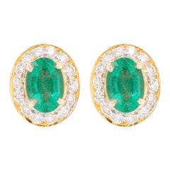 Pendiente de oro de 18 quilates con diamante esmeralda oval de Zambia