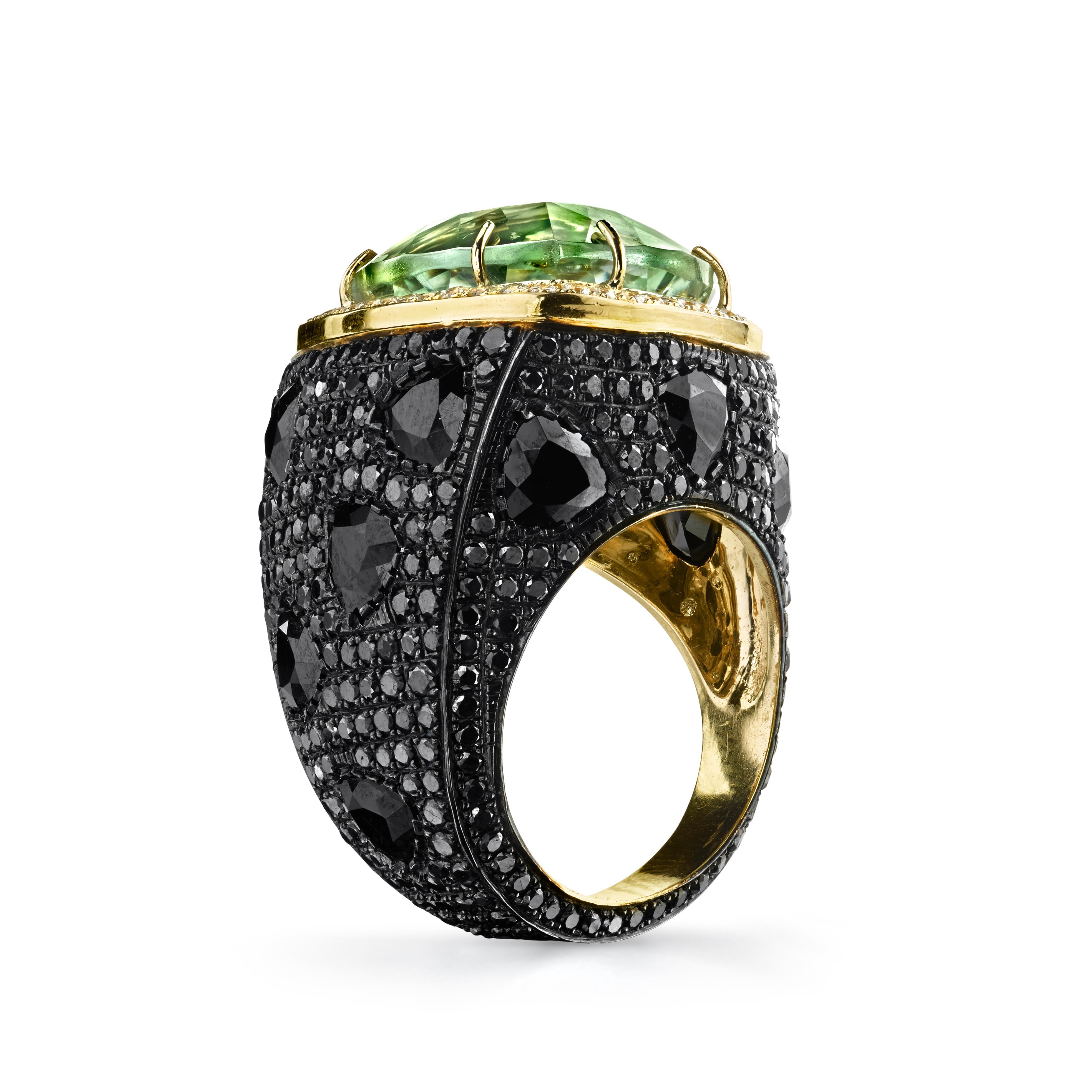 Colorful Green Prasiolite Spinel Black Diamond Triangle Cocktail Ring features a trillion cut green Prasiolite, White diamond trim, black diamond pave, and large trillion cut spinels throughout the base 
18k Yellow Gold 
From Karma El Khalil's Rock