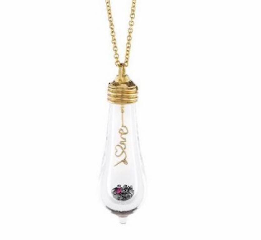 18k Lightkeeper Necklace features a large hand blown glass bulb with the word 