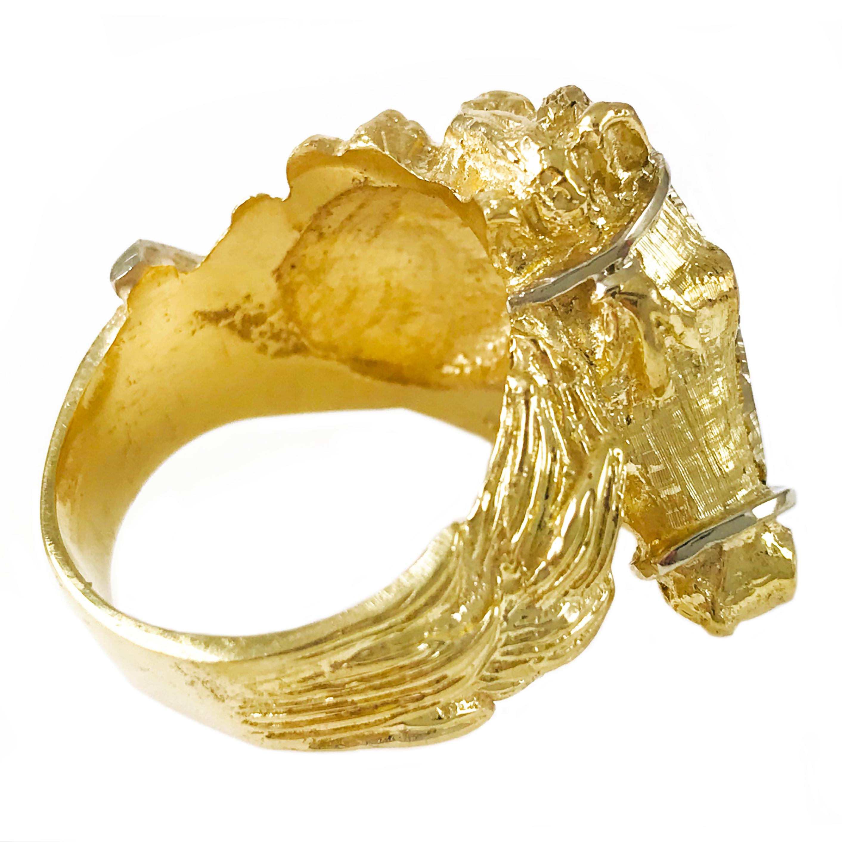 18 Karat Gold Horse Head Ring with white gold reins. Hand-carved horse head smooth and heavy textured finish shows the beauty of the ring. One round single-cut diamond bead set as the eye measuring 2.9mm for a weight of 0.08ct. The ring size is 9