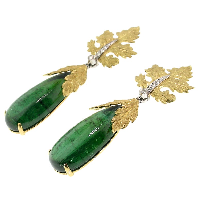 Sylvia earrings are a gorgeous frame for these richly colored Brazilian tourmaline cabochons. The long and elegant pear shapes weigh nearly 36 carats total. These earrings were entirely handmade and hand engraved to compliment these tourmalines