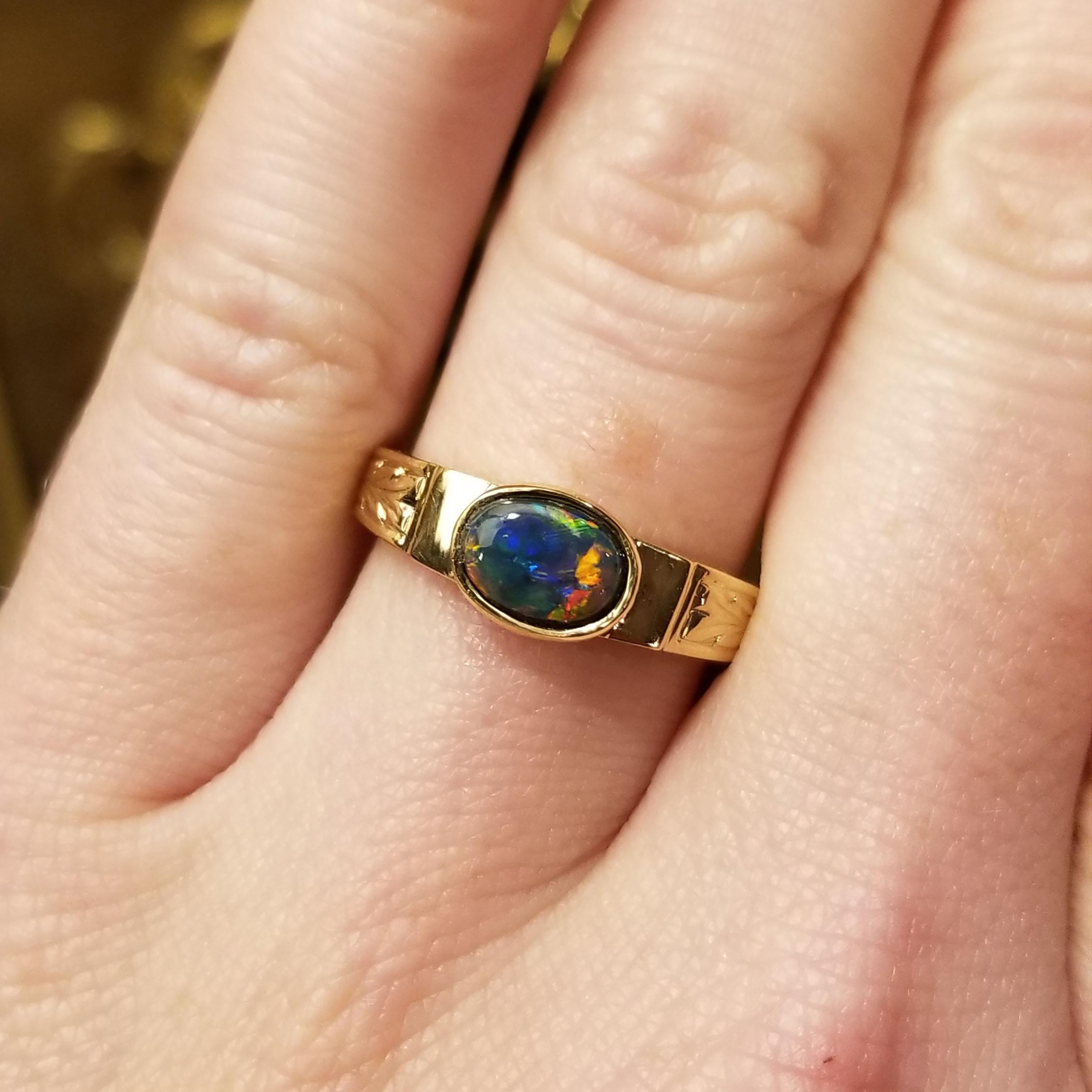 Sometimes, exceptional things come in small packages. This Lightning Ridge black opal is a perfect example; brilliant play of color (including elusive red!) play in broad brushstrokes over the entire surface of the stone. My 18kt Cassandra ring is