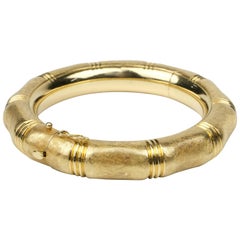 18 Karat Hinged Bangle with Florentine Finish